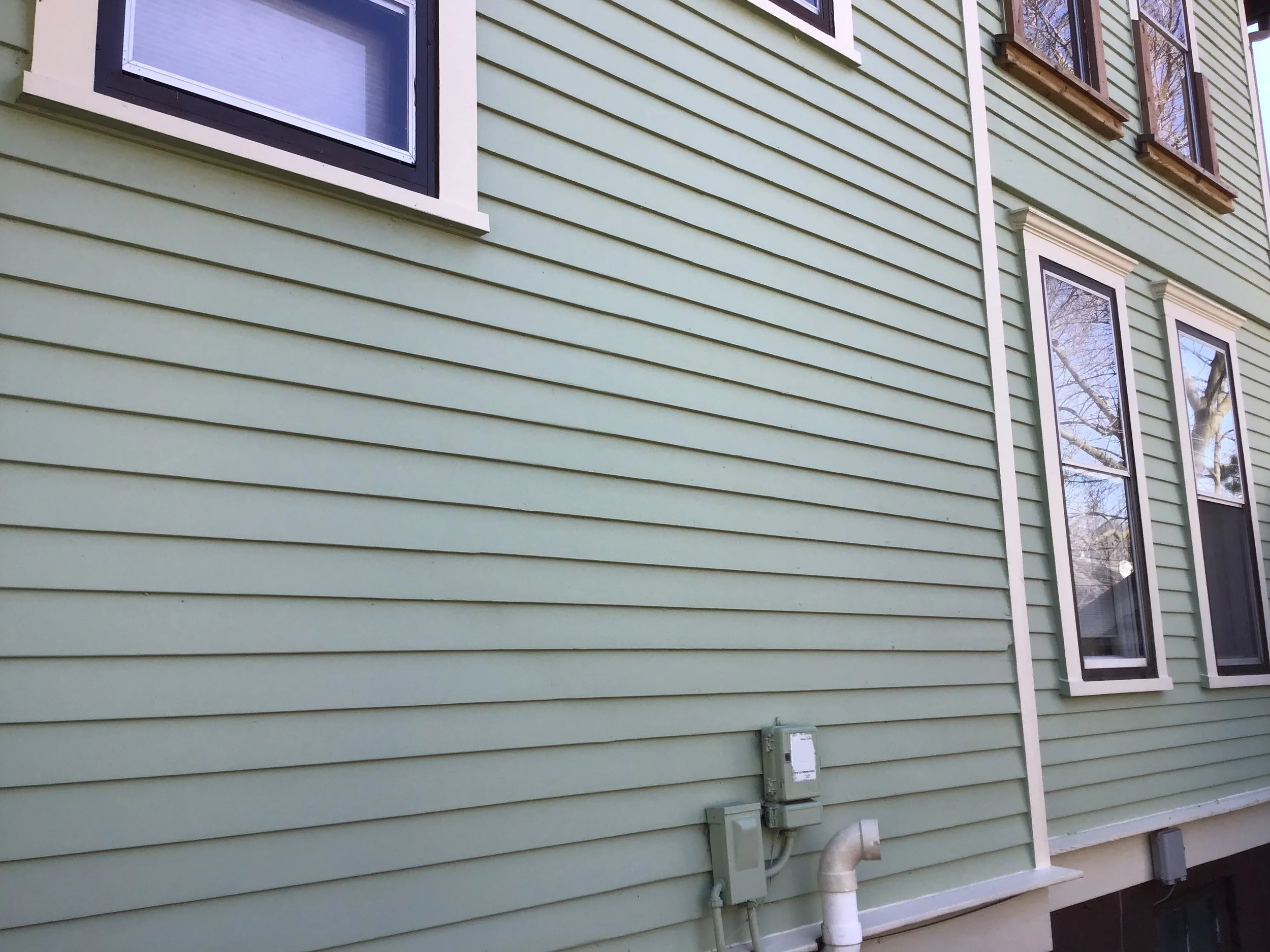 Site of the second phase of the work. Two smaller windows and siding.