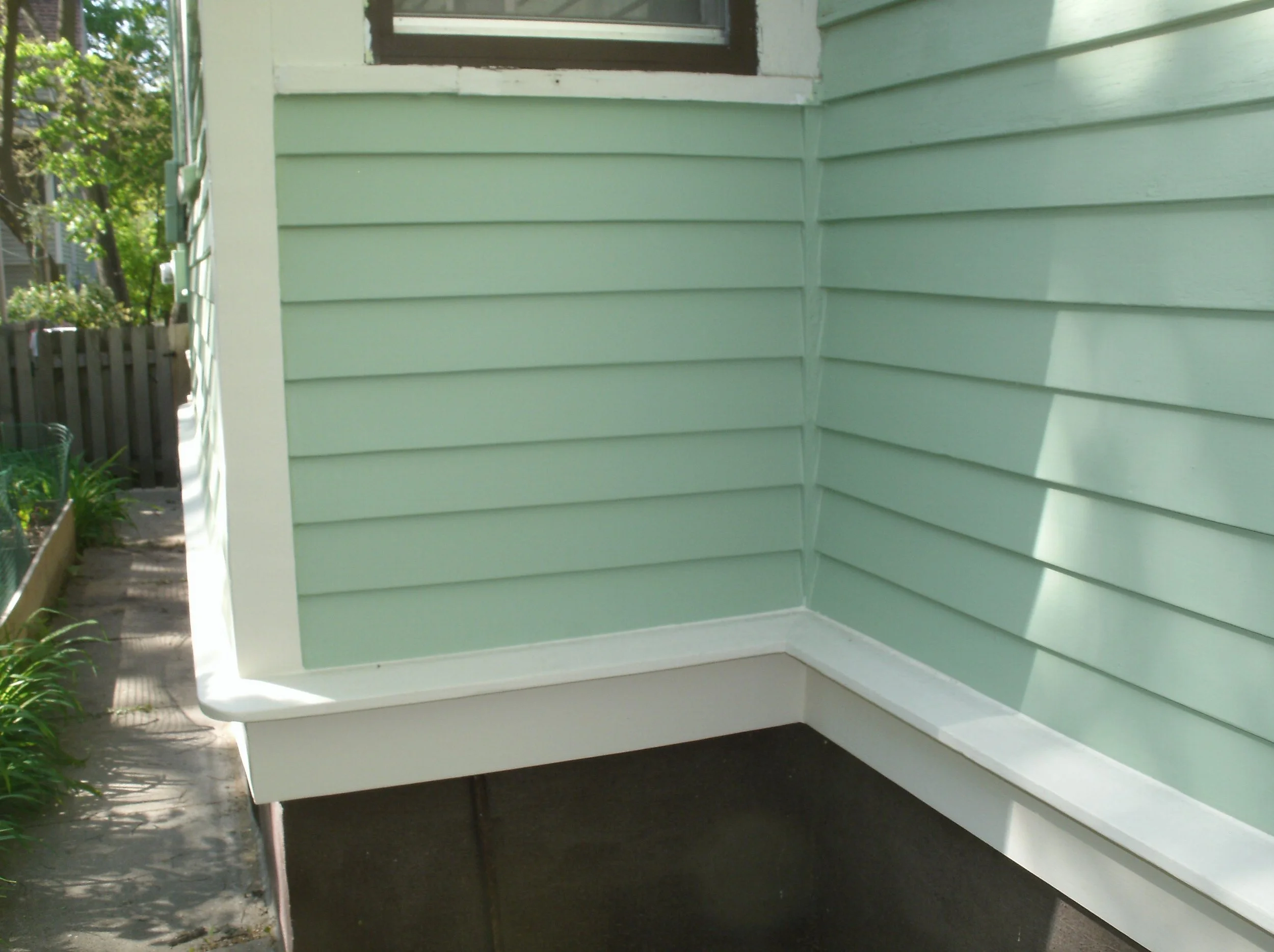Close app of the beautiful new painted siding and drip edge.