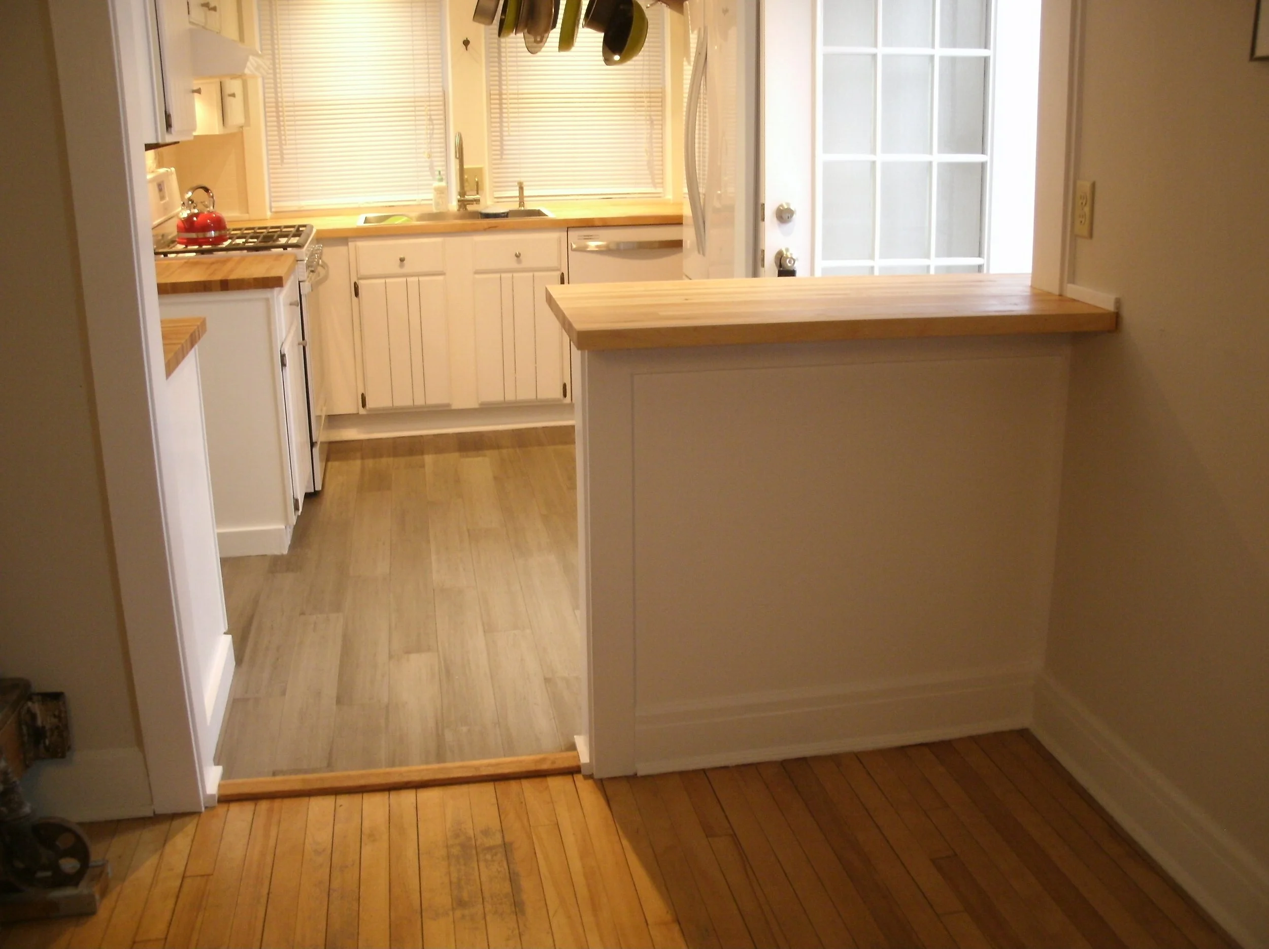 Living room side of room divider wall with fabricated, matching trim