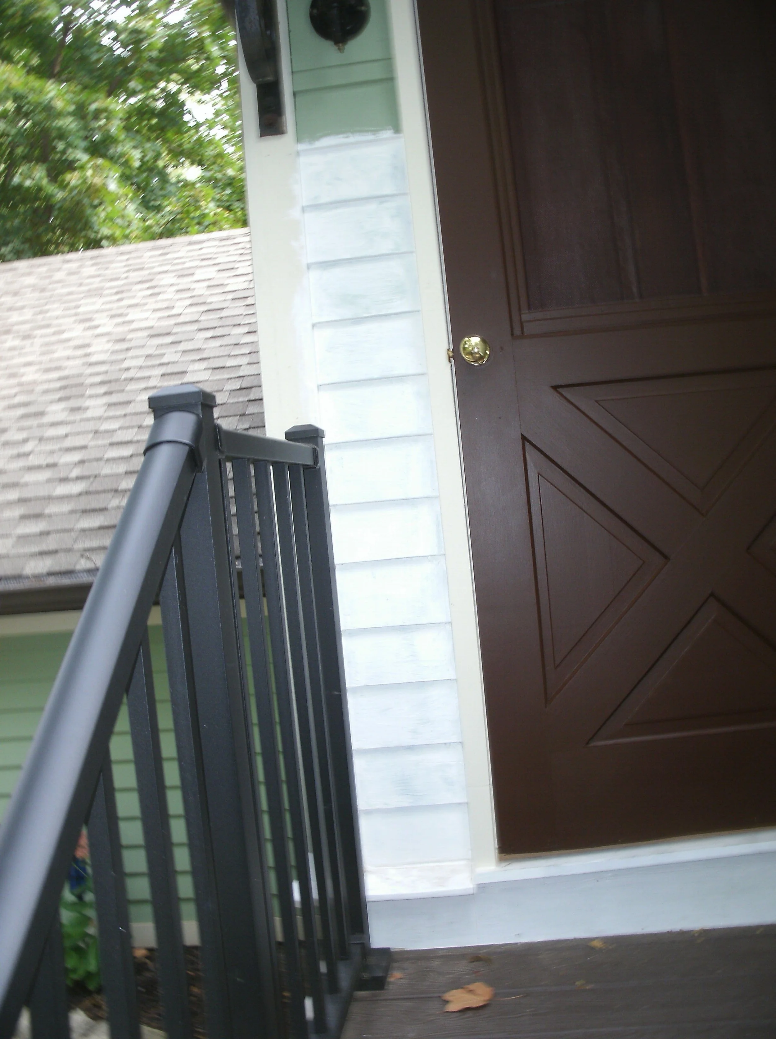 Another view of the new wood next to and under the storm door.