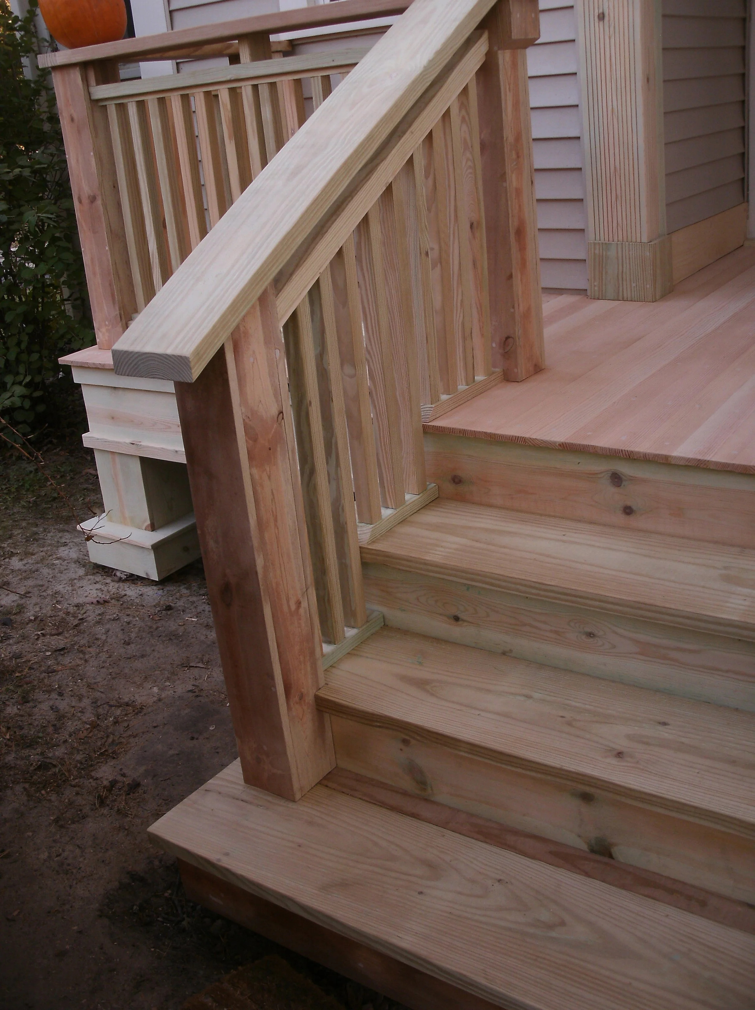 A view of the stairs, decking, and column trim