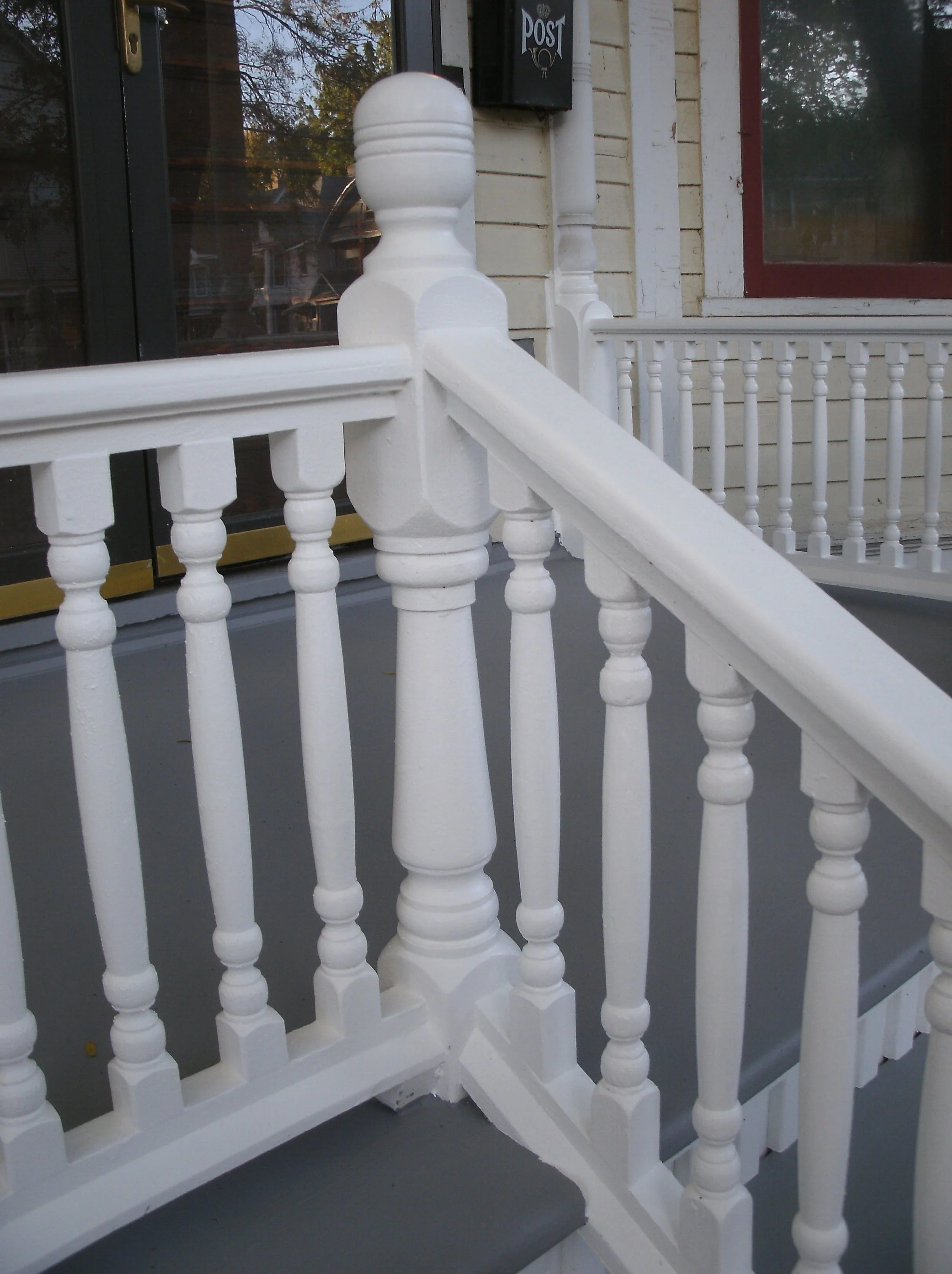 Porch railings detail especially turned corner post.