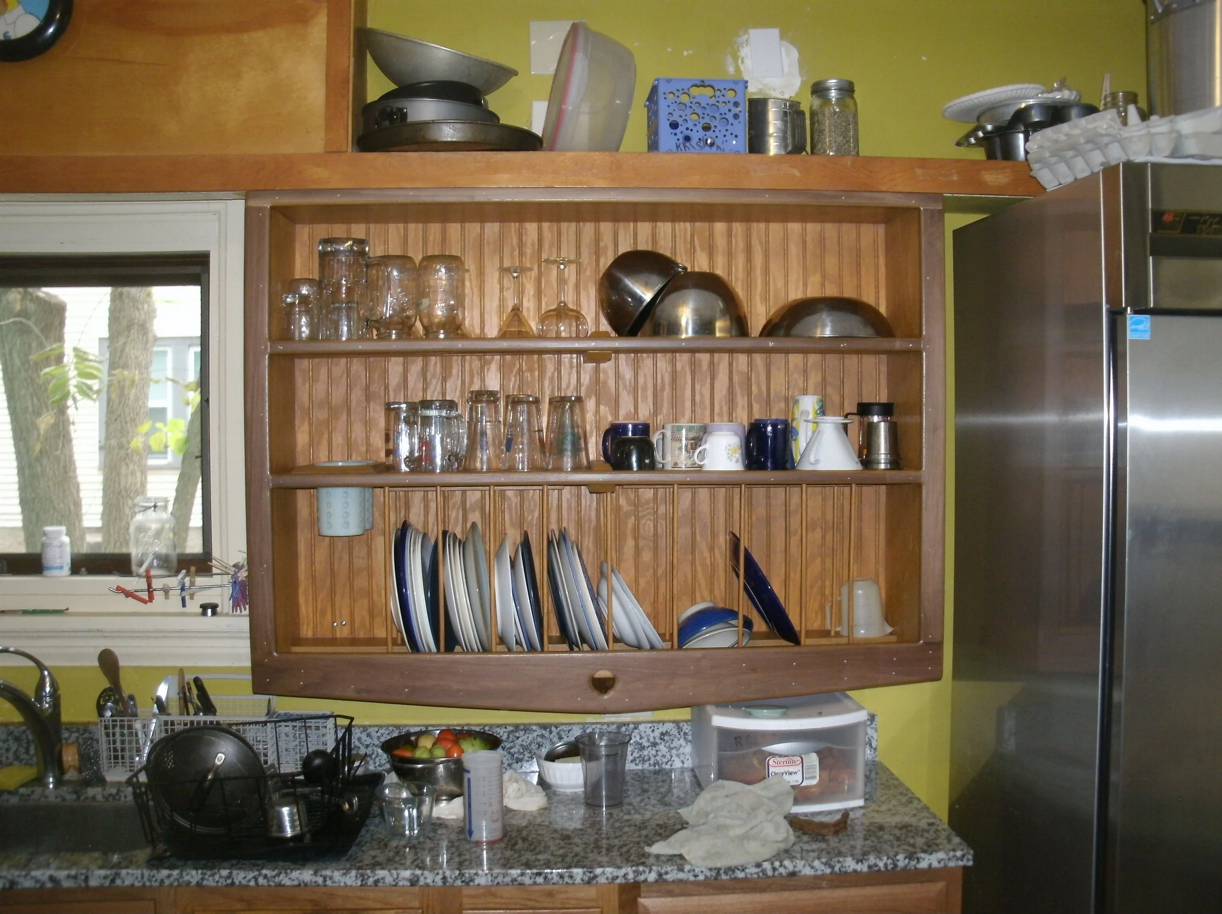 Full front view of dish drying and storage shelving unit