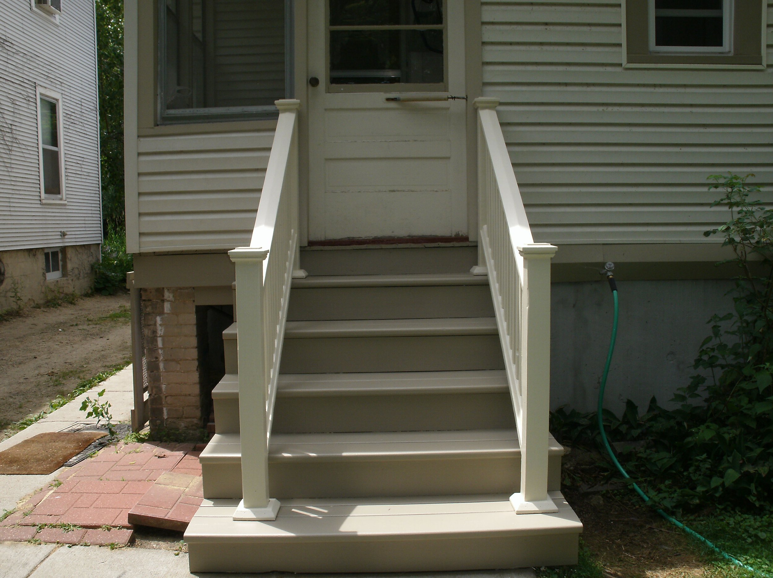 Front view of the new back stairs painted.	