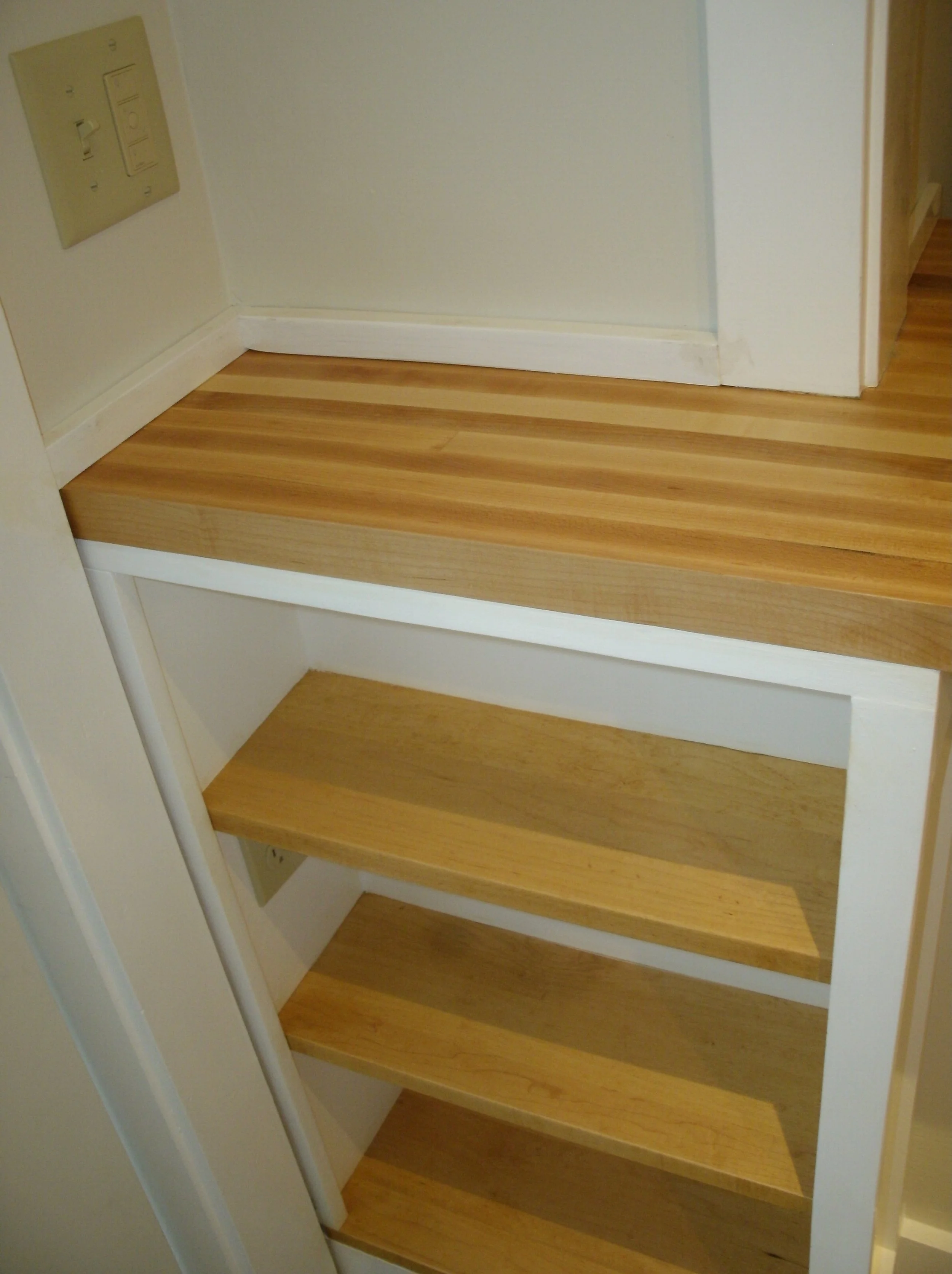 Three new shelves next to the exterior door