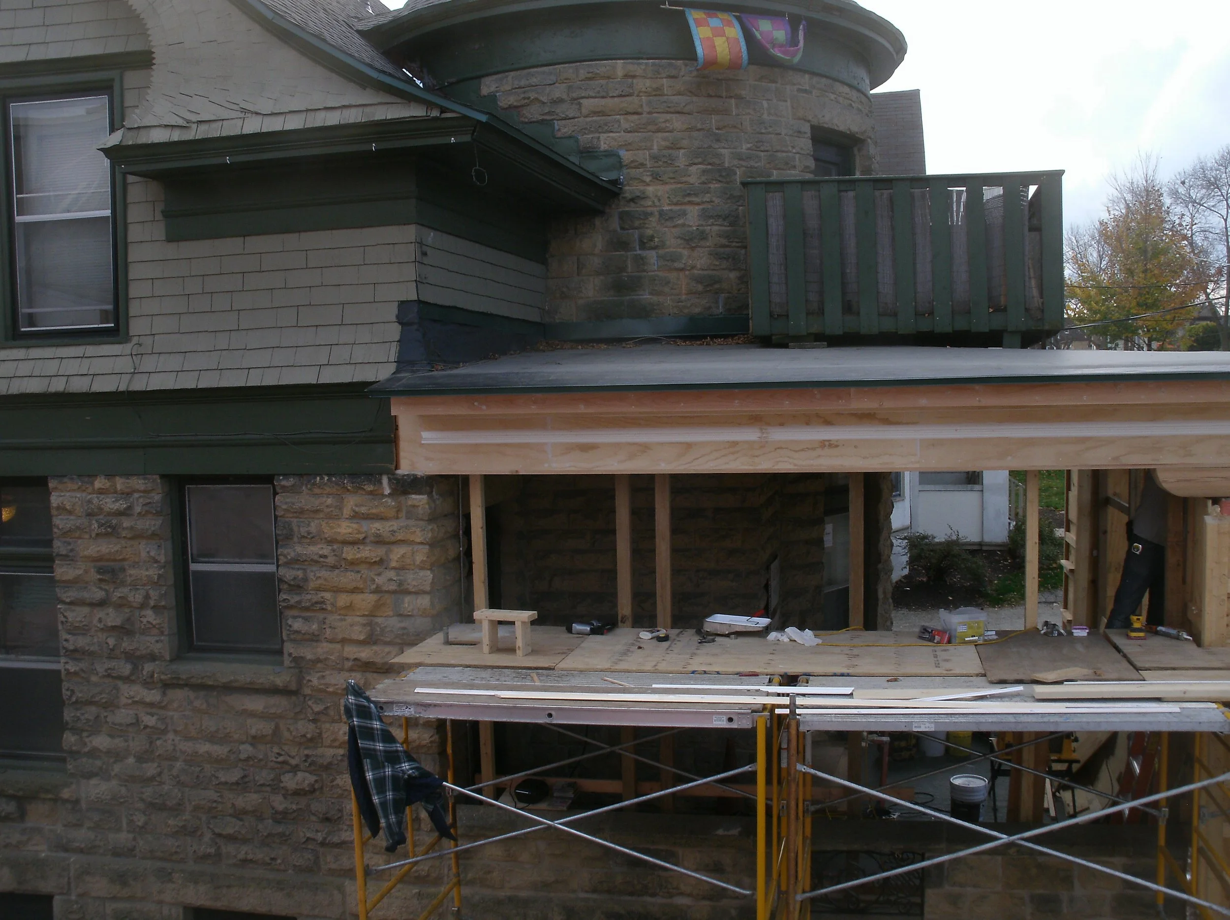 Cladding and trimming terminating at the main house, phase 2 of the restoration.