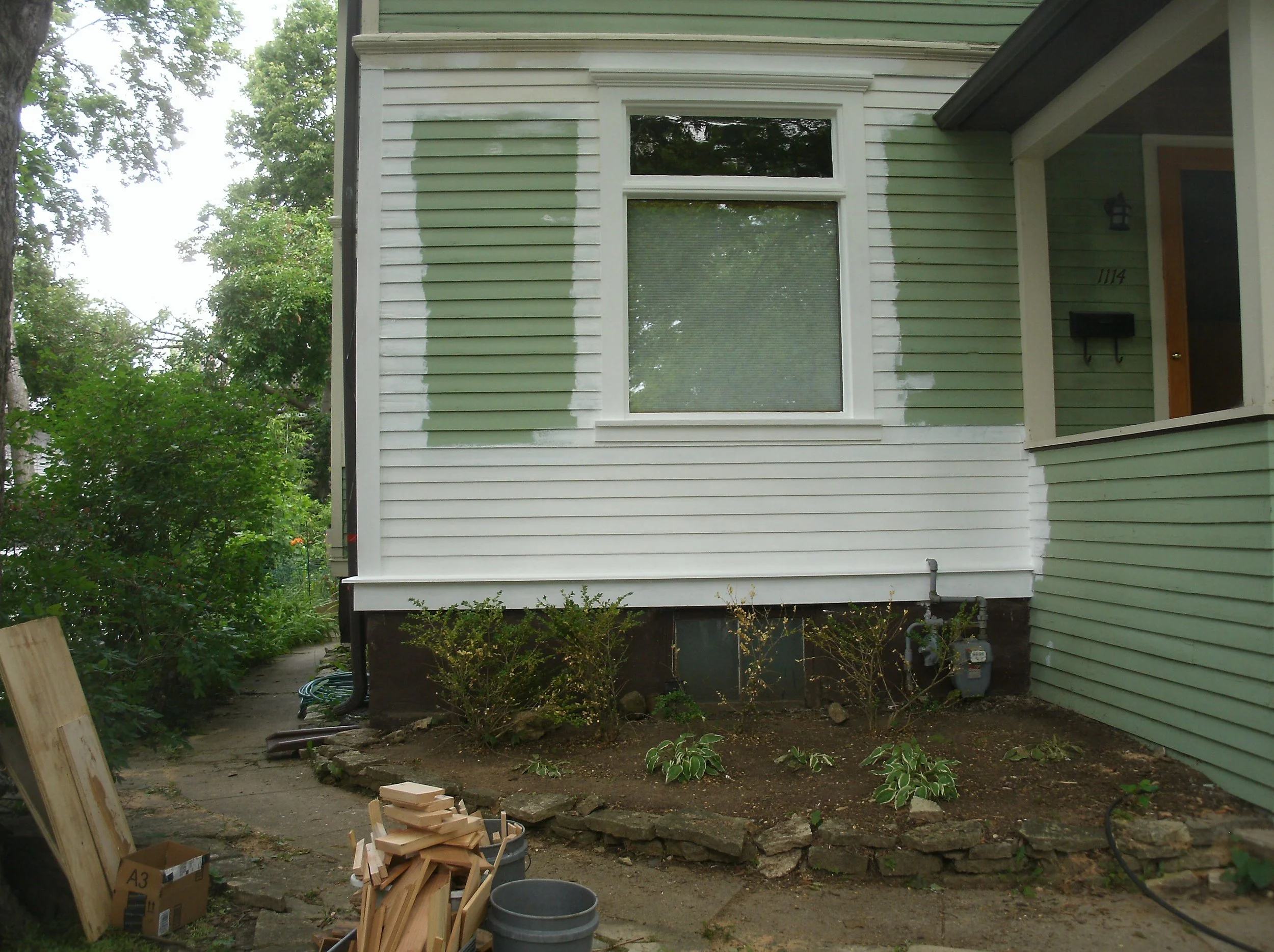 New window trim and siding replaced as necessary, primed and painted.