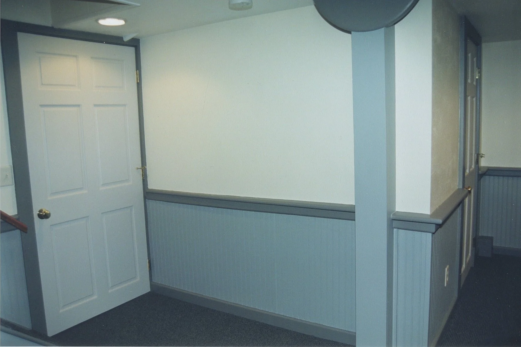 Door to unfinished traditional basement (laundry, storage)