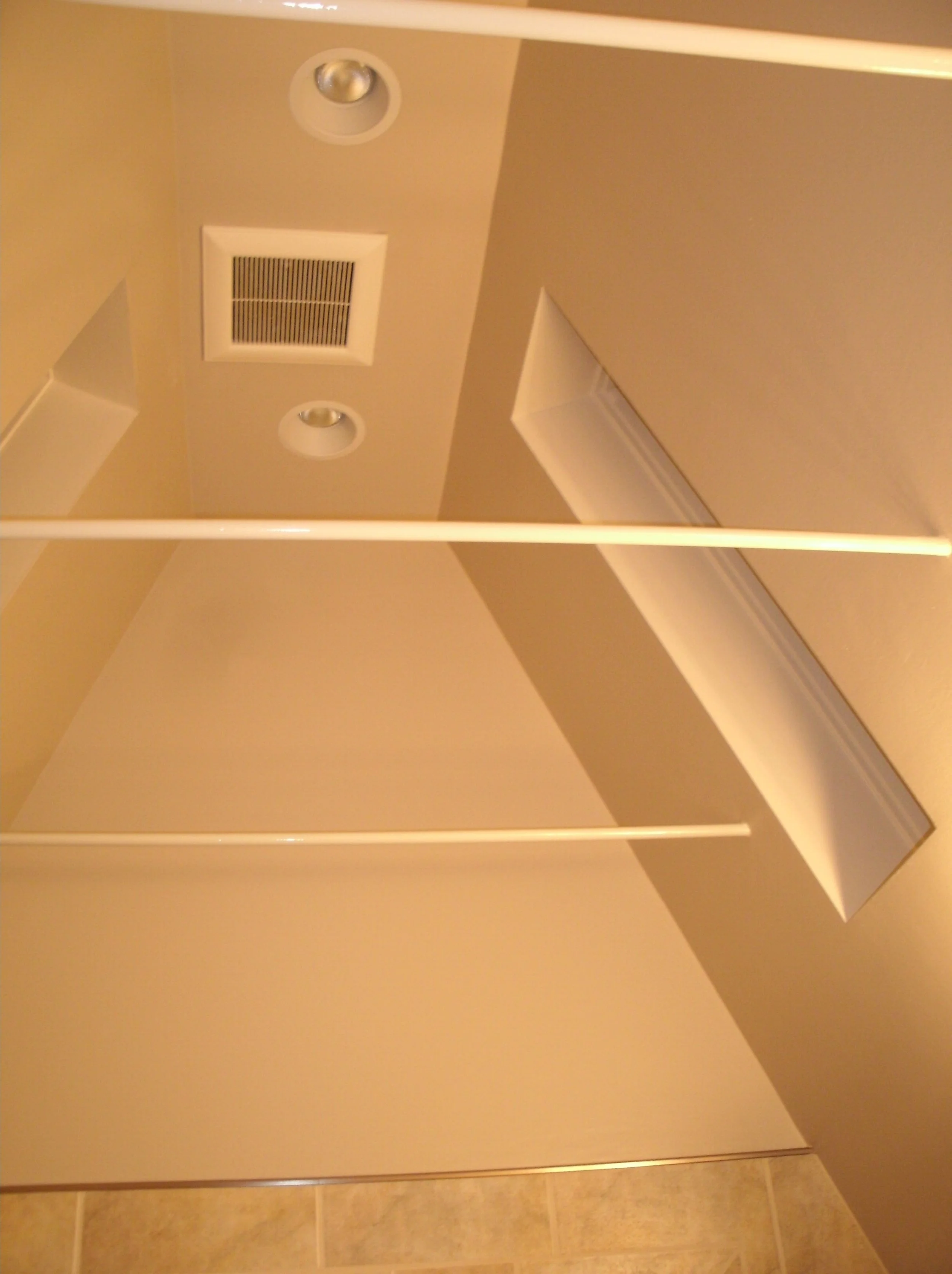 Ceiling and walls drywalled and painted, threaded rods installed painted