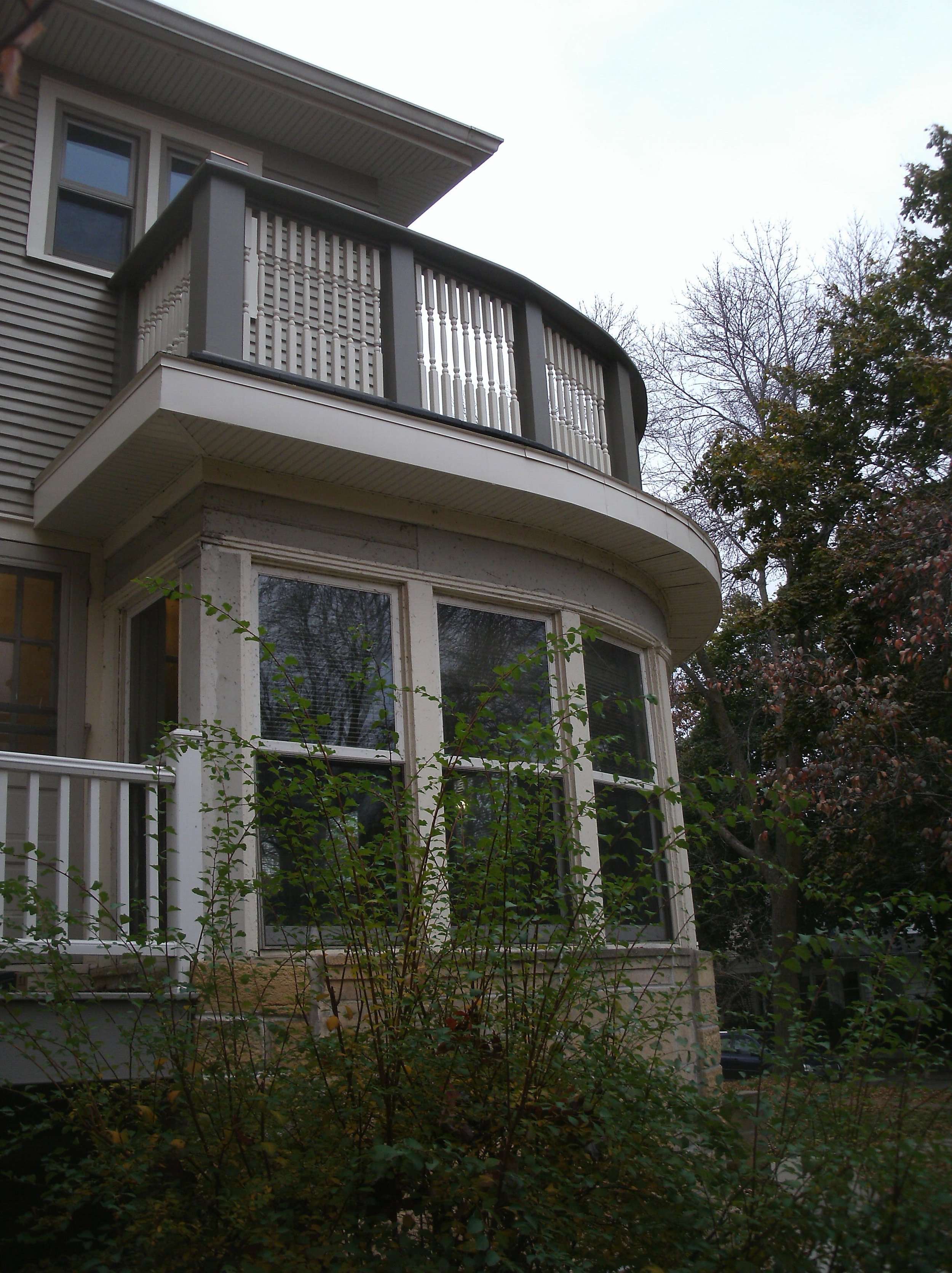 Another view from the ground of the driveway side of the beautiful curved railing top.