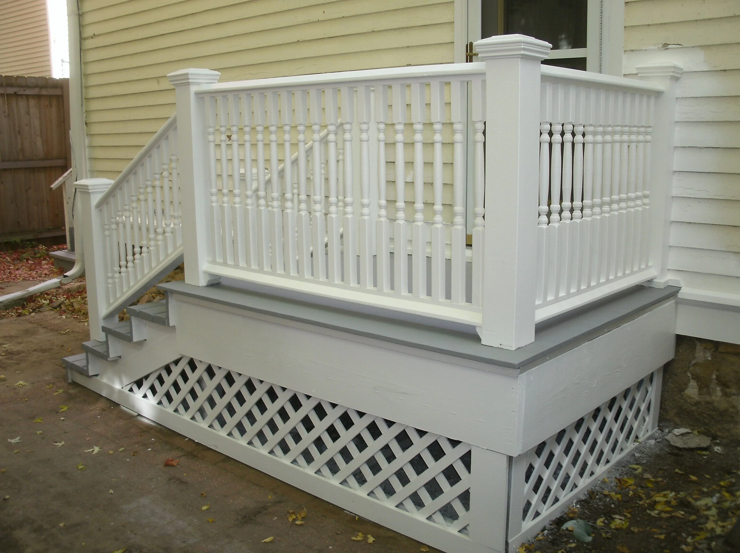 One view of the side porch inside the fenced/gated side/back yard.