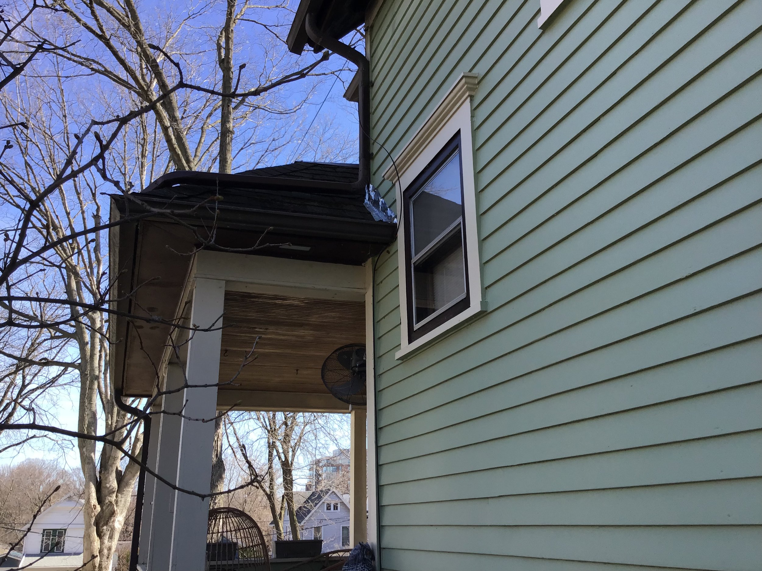 View of the once most damaged window and the new flashing and gutter.