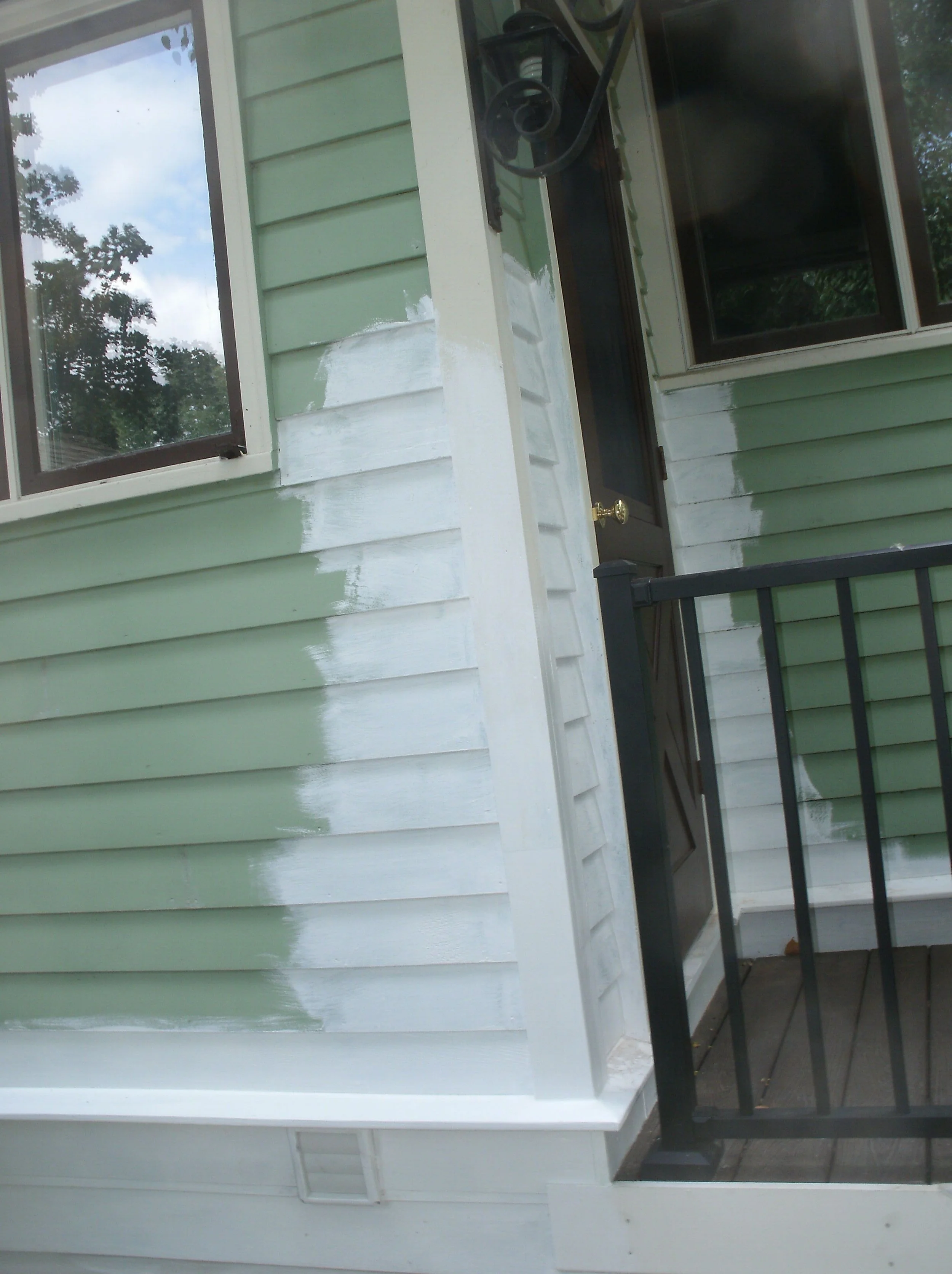 All the new wood flanking the rear storm door and adjacent drip edge. Primed.