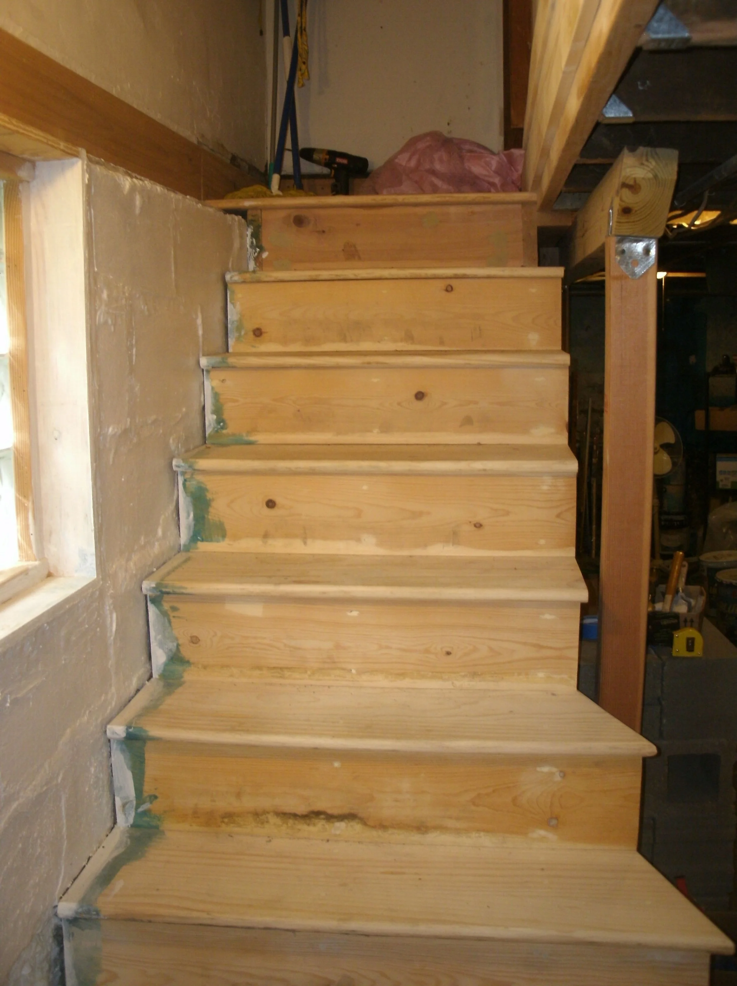 New stairs with partial view of improved support for first floor hallway