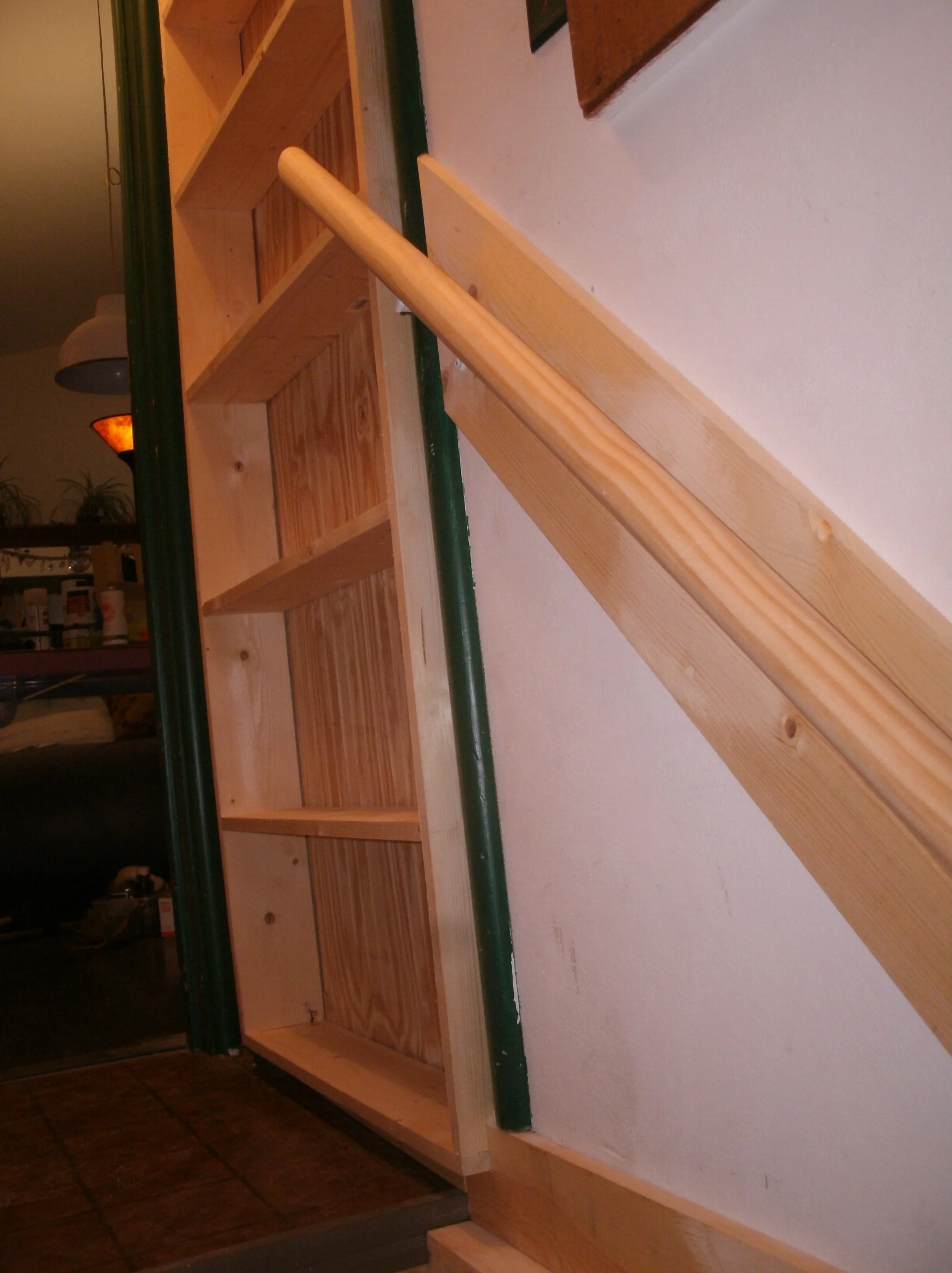 Detailed view of the pantry shelves and top of handrail