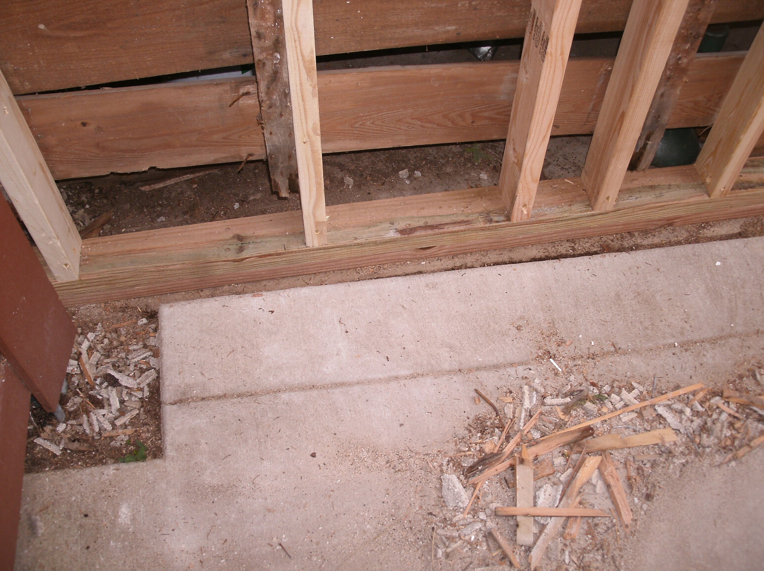 The right hand wall with new treated bottom plate and studs installed