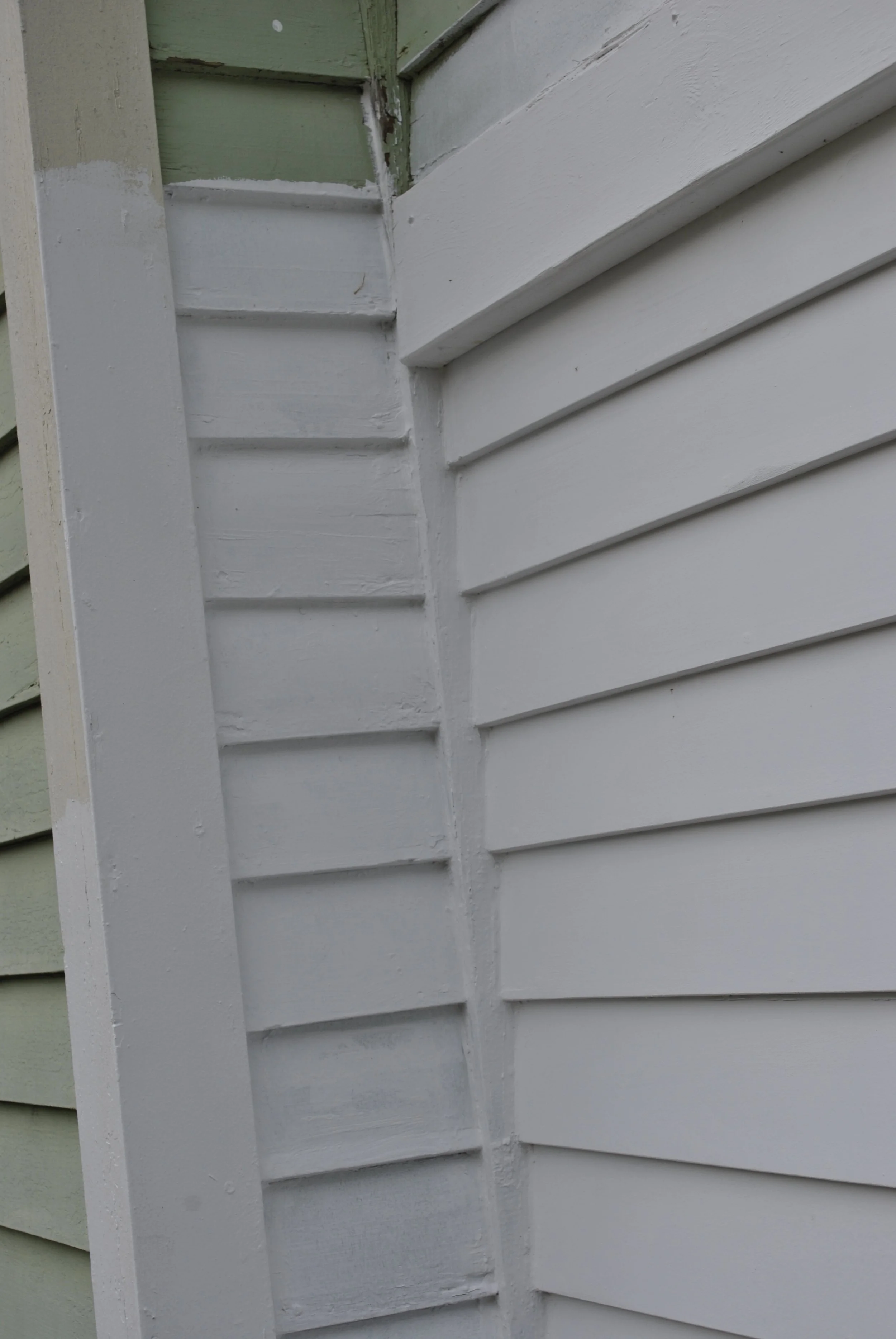 More new siding and vertical inside corner trim and outside corner trim.
