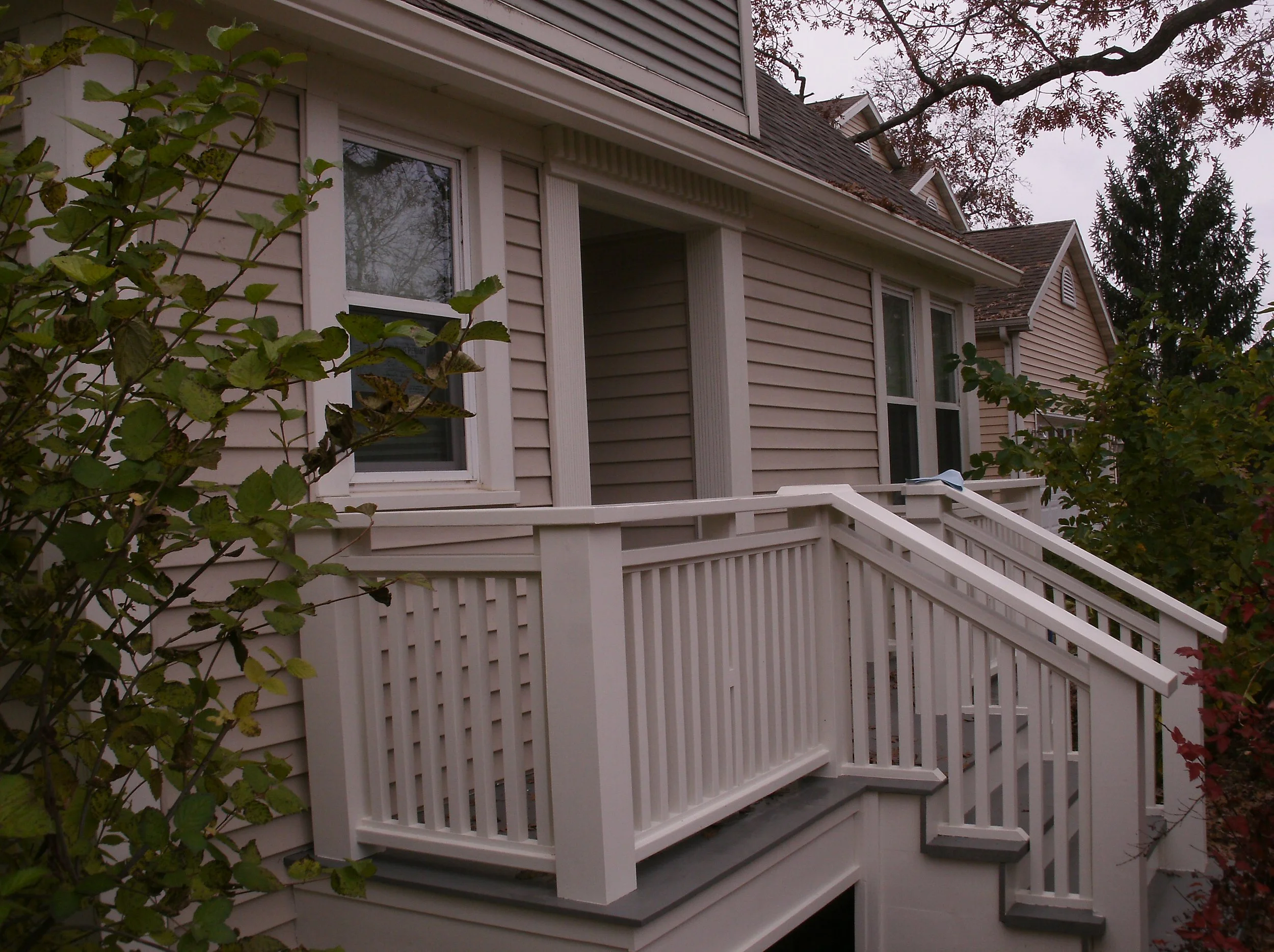 The new welcoming porch and stairs painted a nice cream color