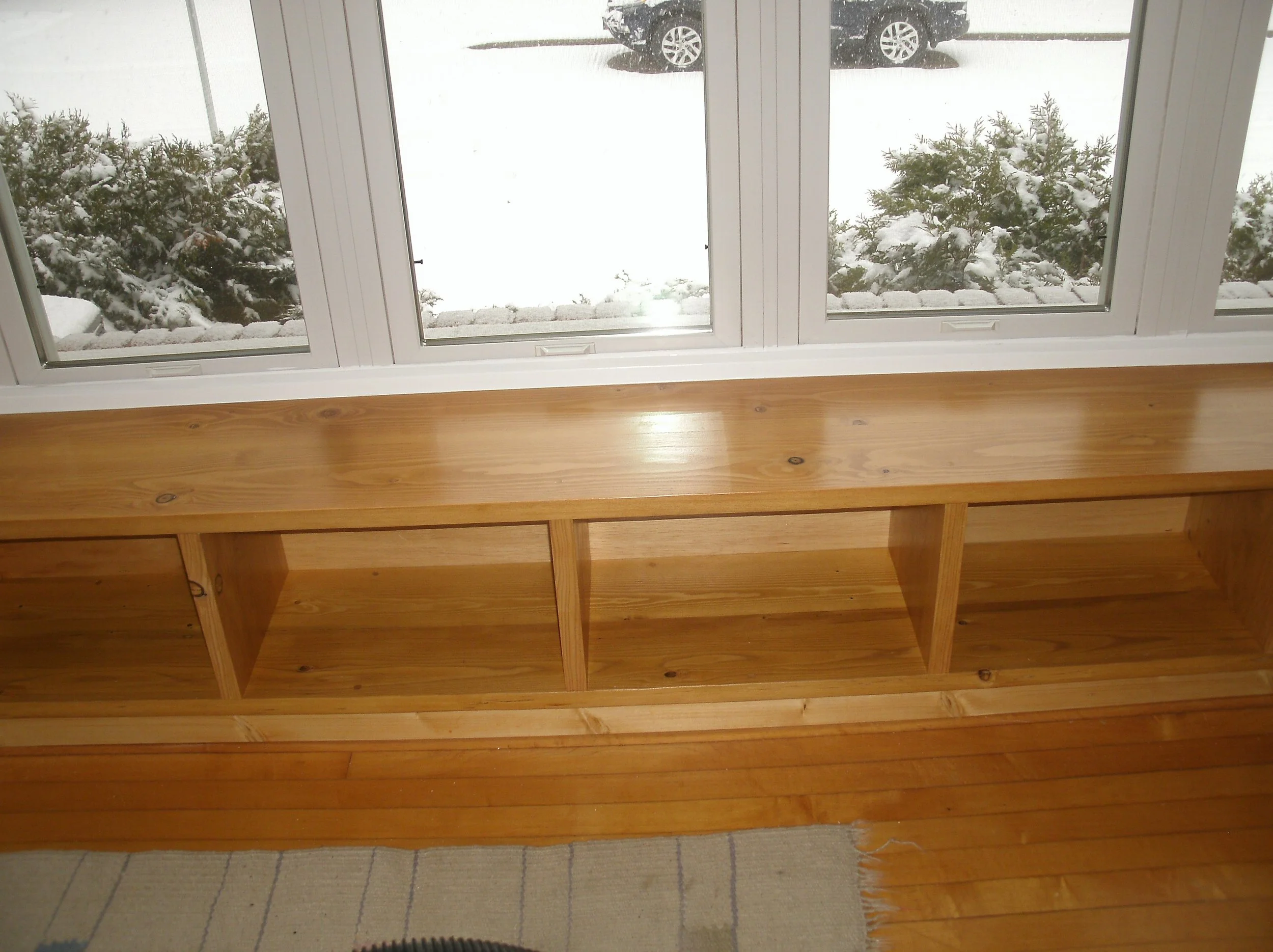 Shelf below the wall of windows