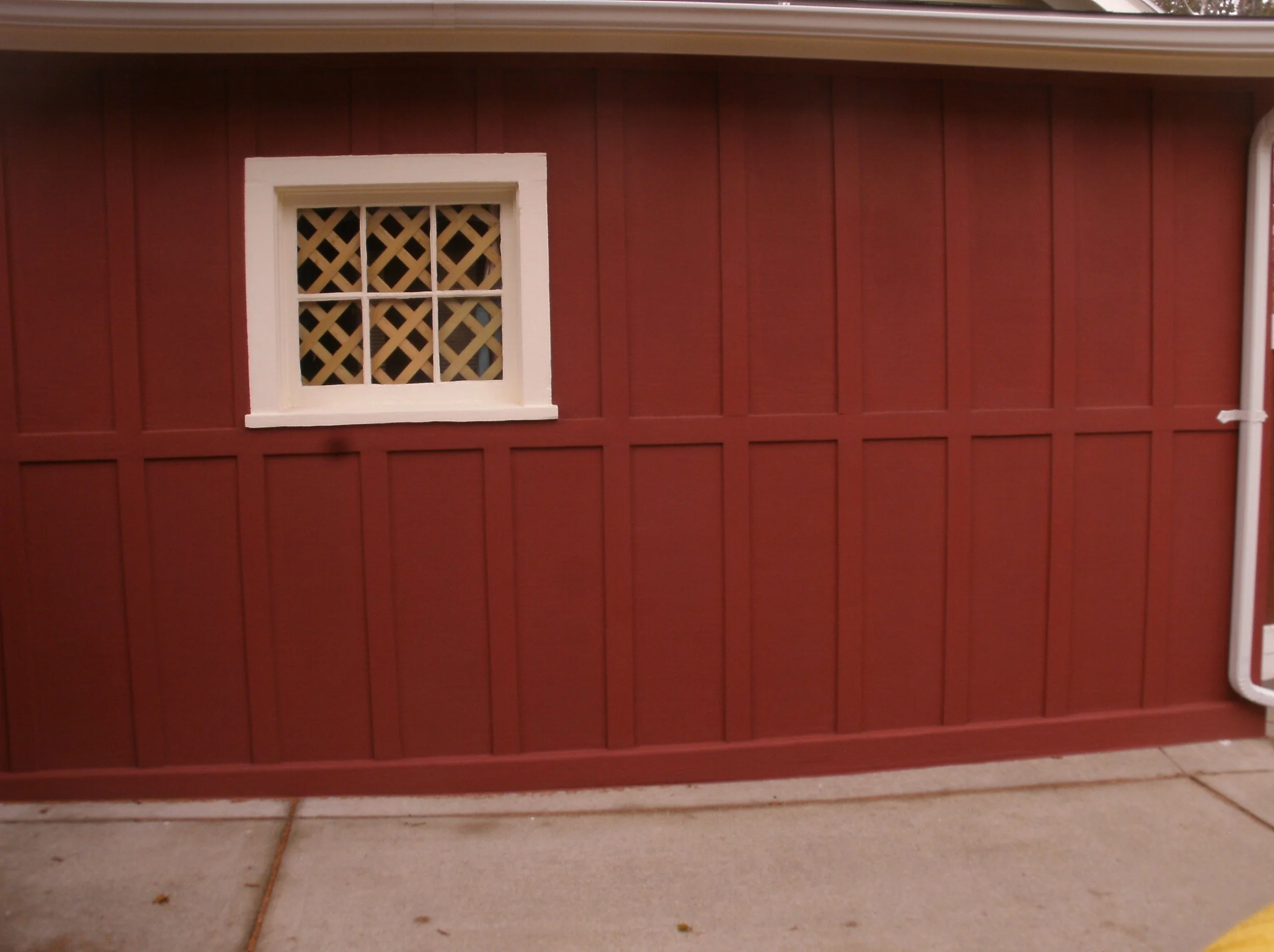 Left side wall sheathed, trimmed, sealed, primed, and painted