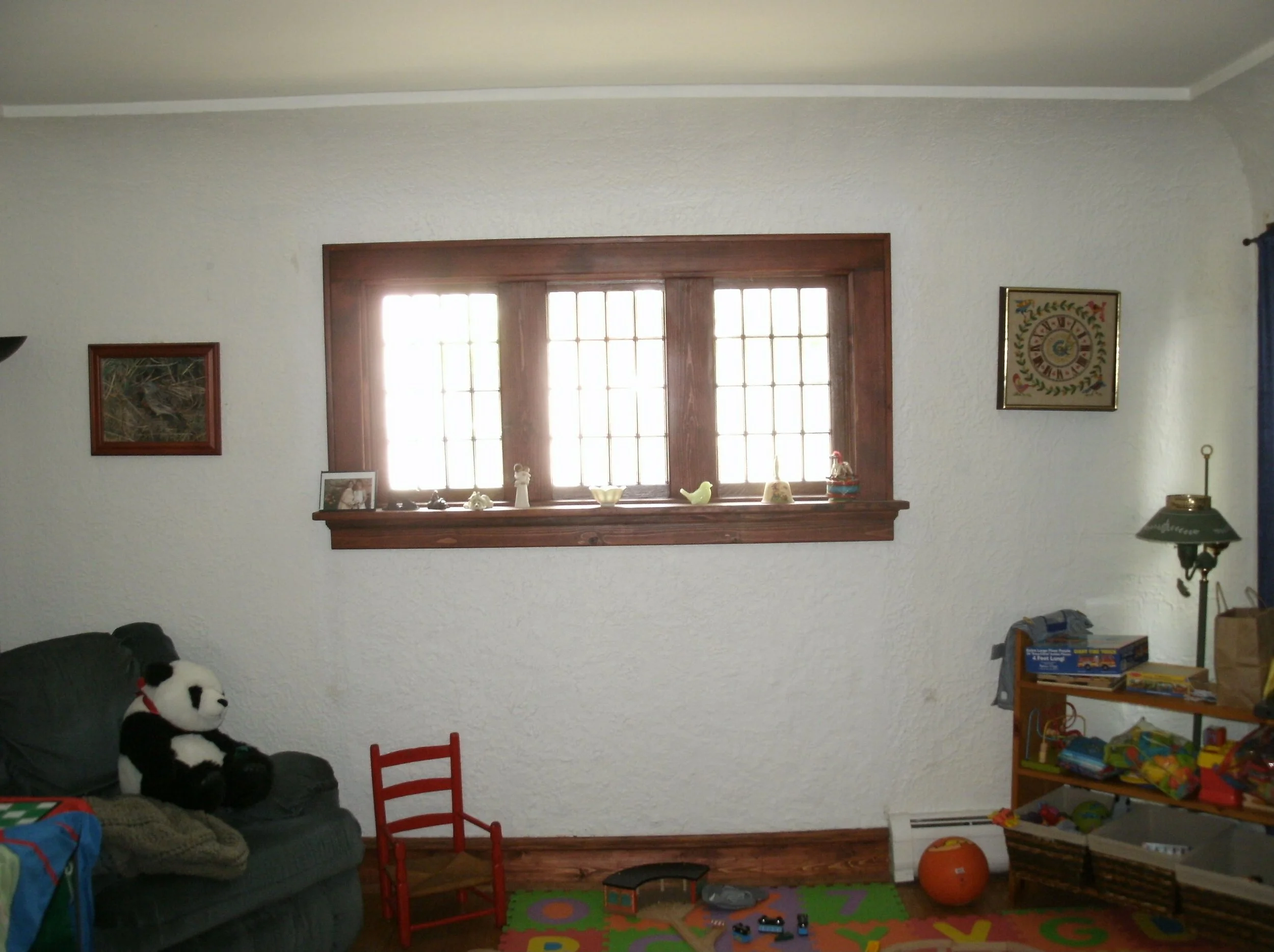 Full view of wall with DeConstruction, Inc. antique windows installed and trimmed.		
