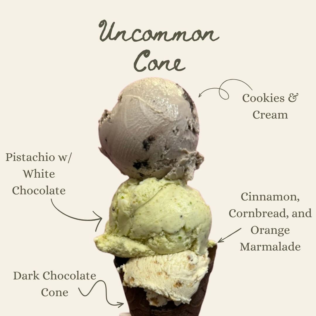 Large ice cream cone with cookies and cream, pistachio and cinnamon cornbread and jam