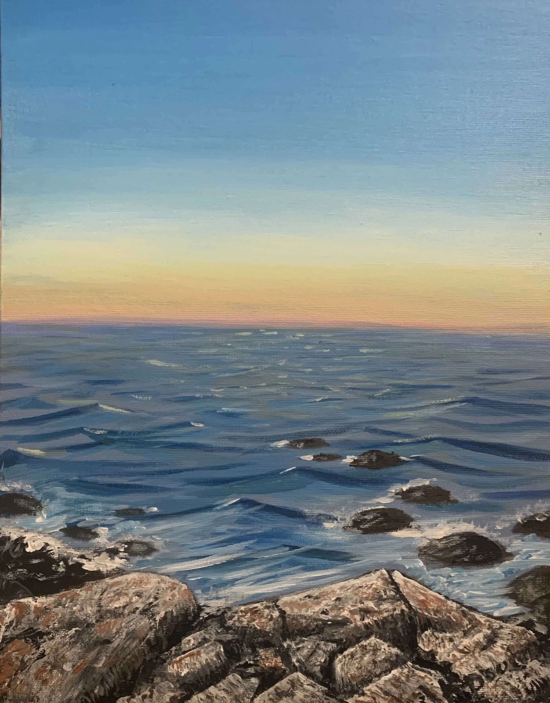 Painting of a seascape with rocks in the foreground and a sunset over the ocean in the background.