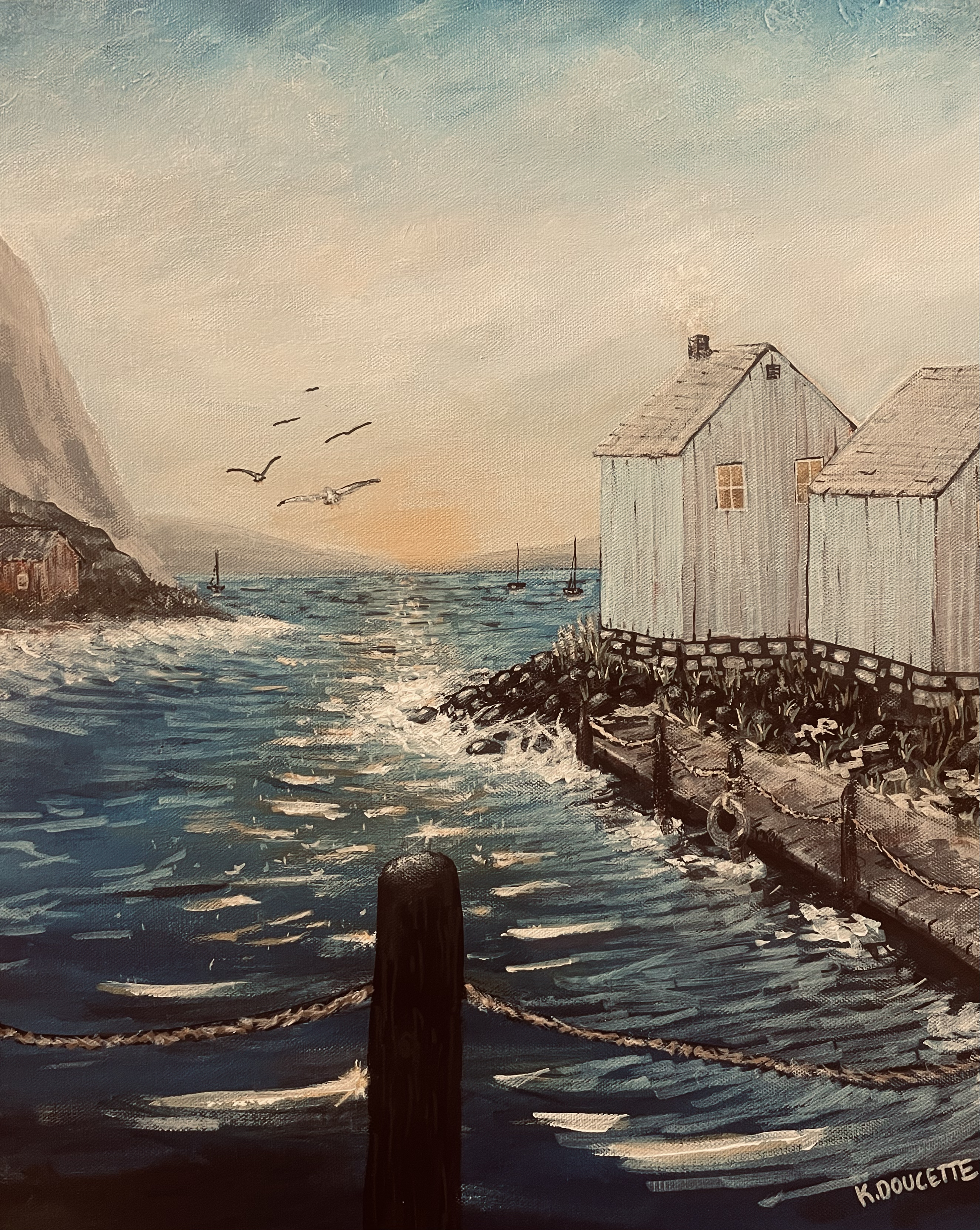Seaside landscape painting with two white houses on a dock, seagulls flying, and boats on a calm sea at sunset.
