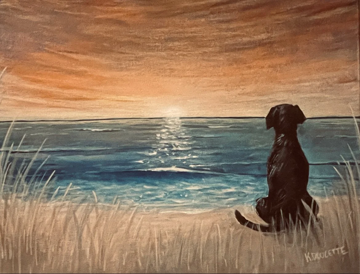 A painting of a black dog sitting on a sandy beach, watching an ocean sunset. The sky is orange and the water reflects the light.