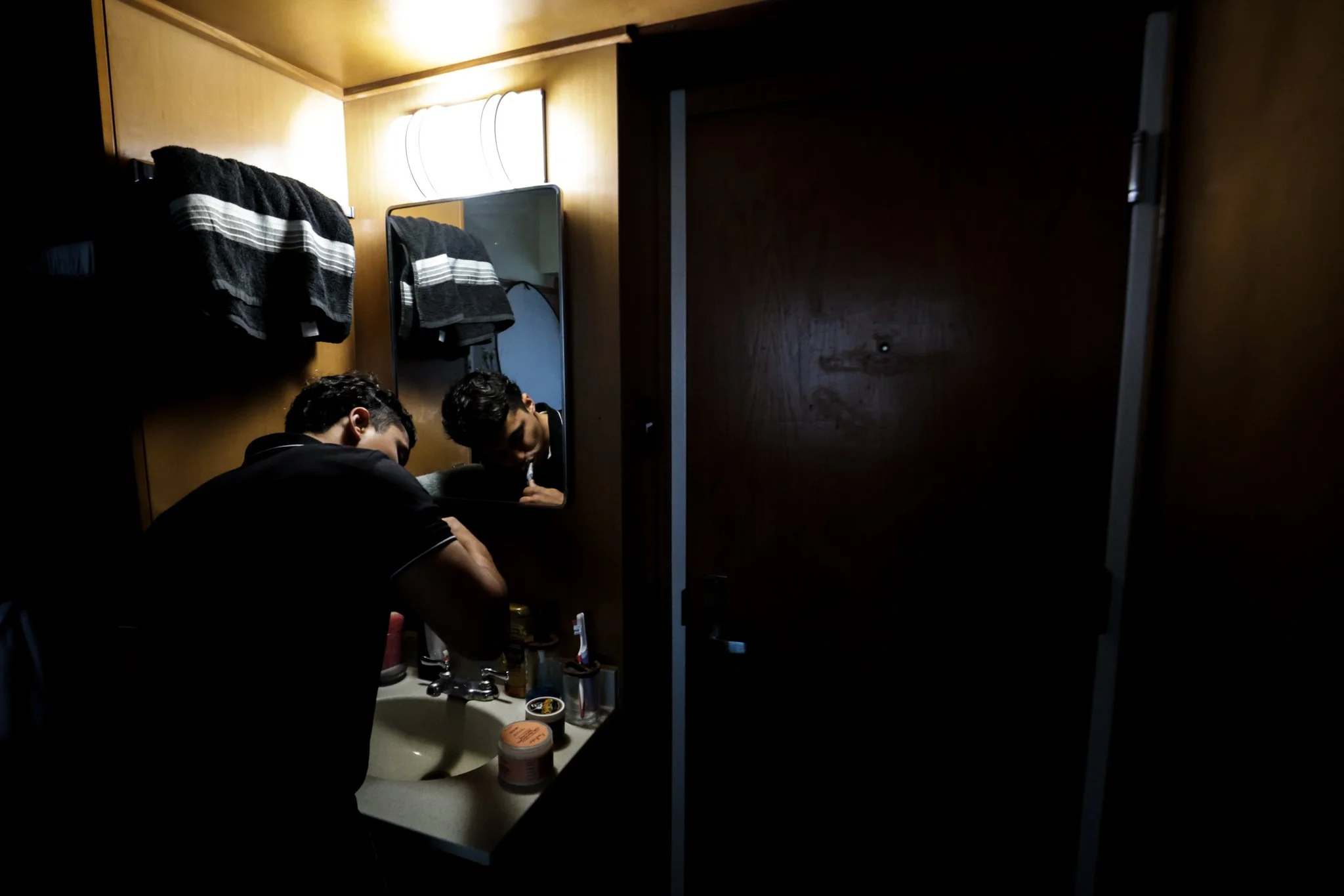 Juan Aguirre, a Dallas native, brushes his teeth before starting his day full of classes and appointments.