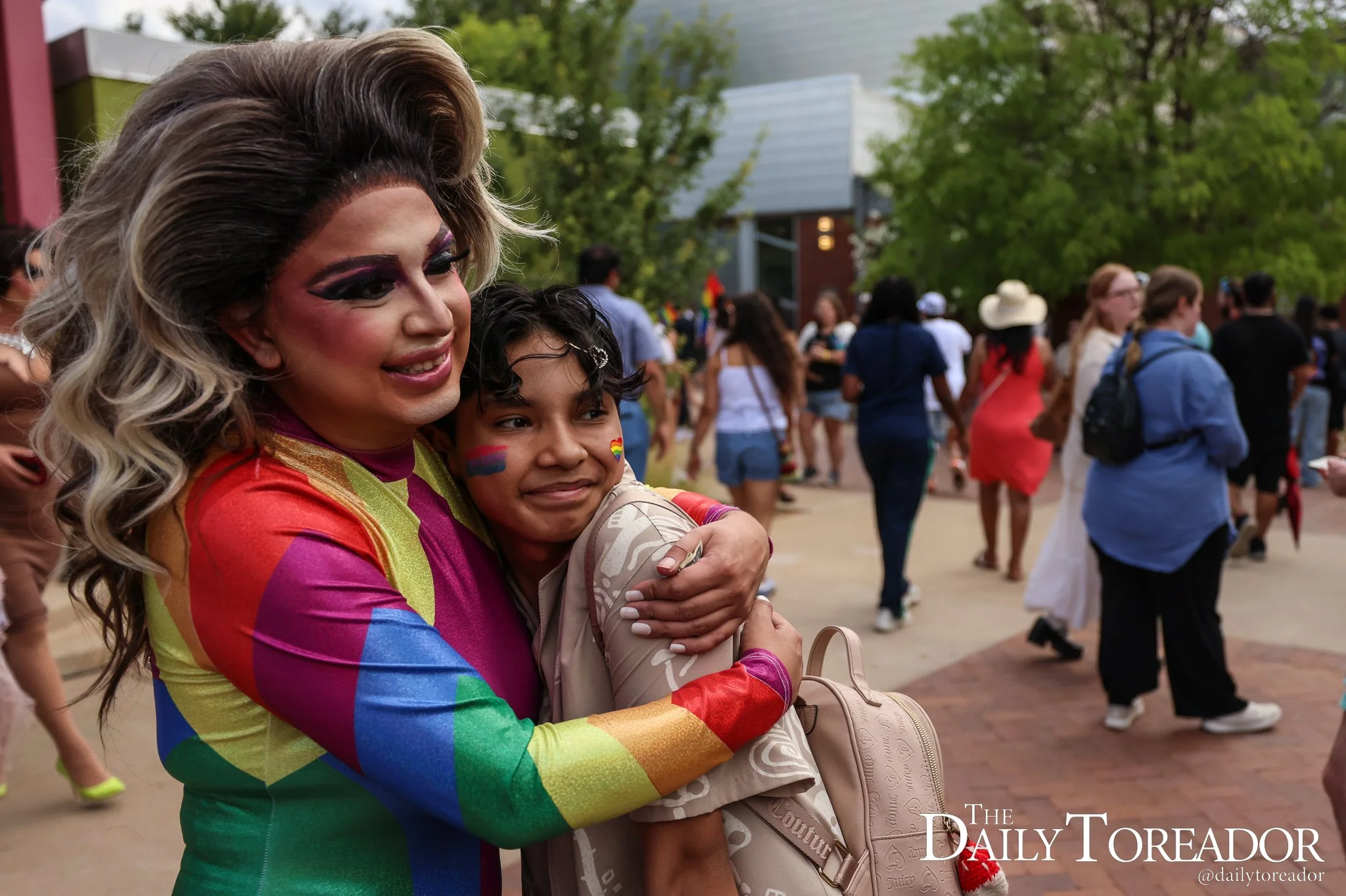 Vanessa Stefani, a Lubbock drag queen, hugs an audience member after performing at Lubbock PRIDE's Pride Fest at the Louise Hopkins Underwood Center for the Arts in downtown Lubbock, June 28, 2025. Stefani said that the Drag community in Lubbock uses
