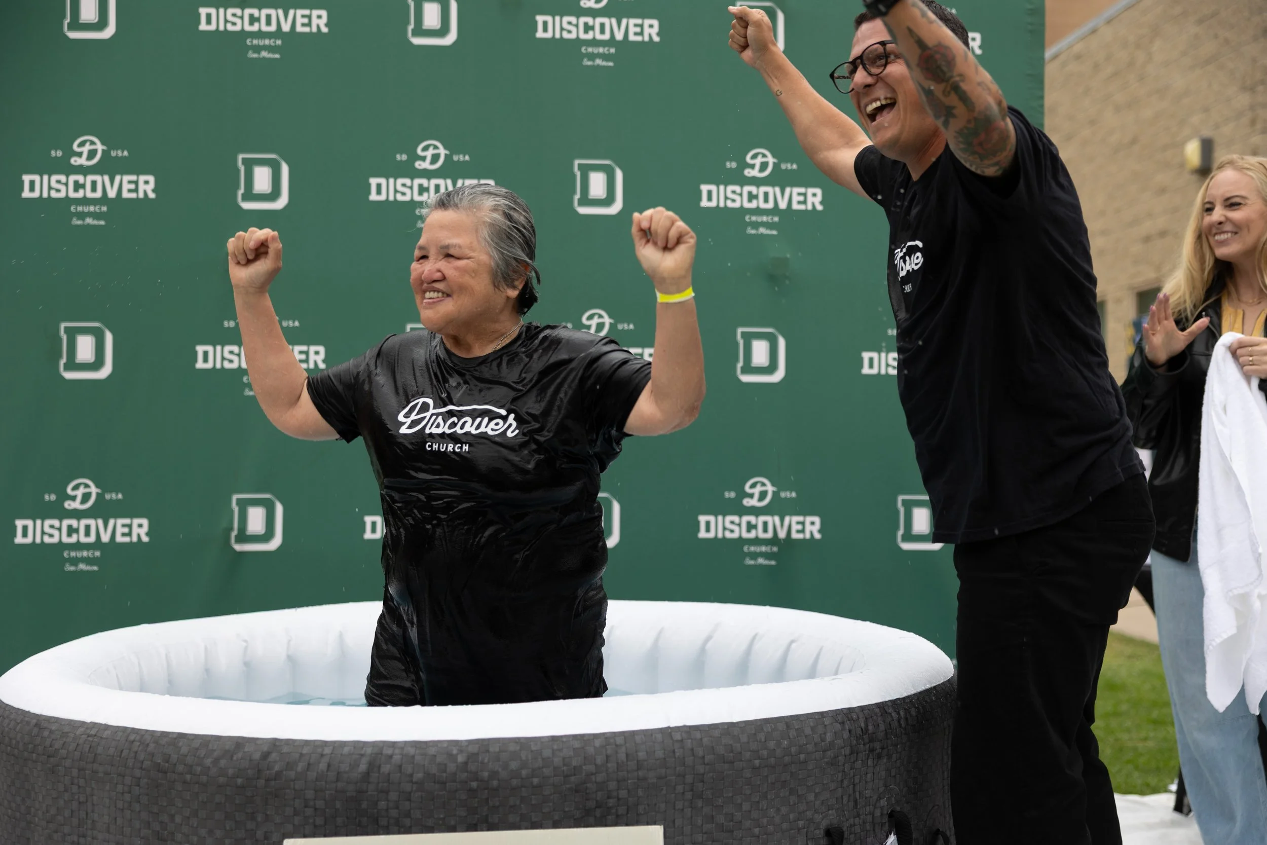 An older woman who just got water baptized at Discover Church in San Diego by Pastor Kyle Veach on Baptize the World Day. Located at Mission Hills High School in San Marcos, CA.