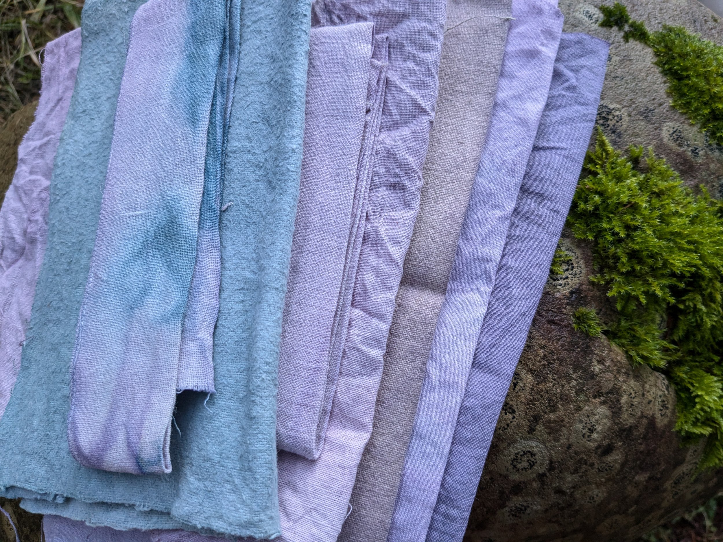 Range of purple and blue swatches, naturally dyed upcycled fabric.