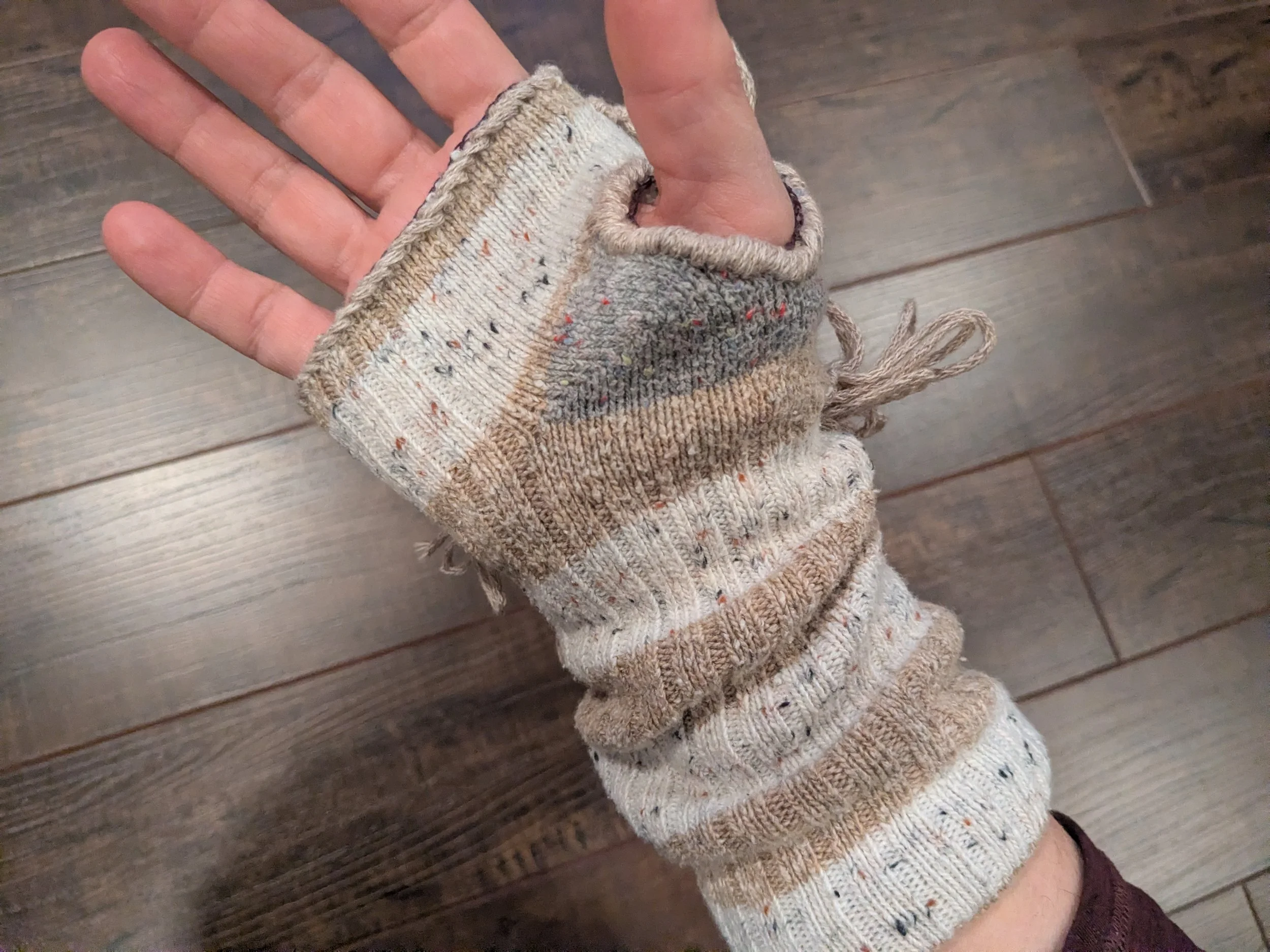 Reworked socks into fingerless gloves.