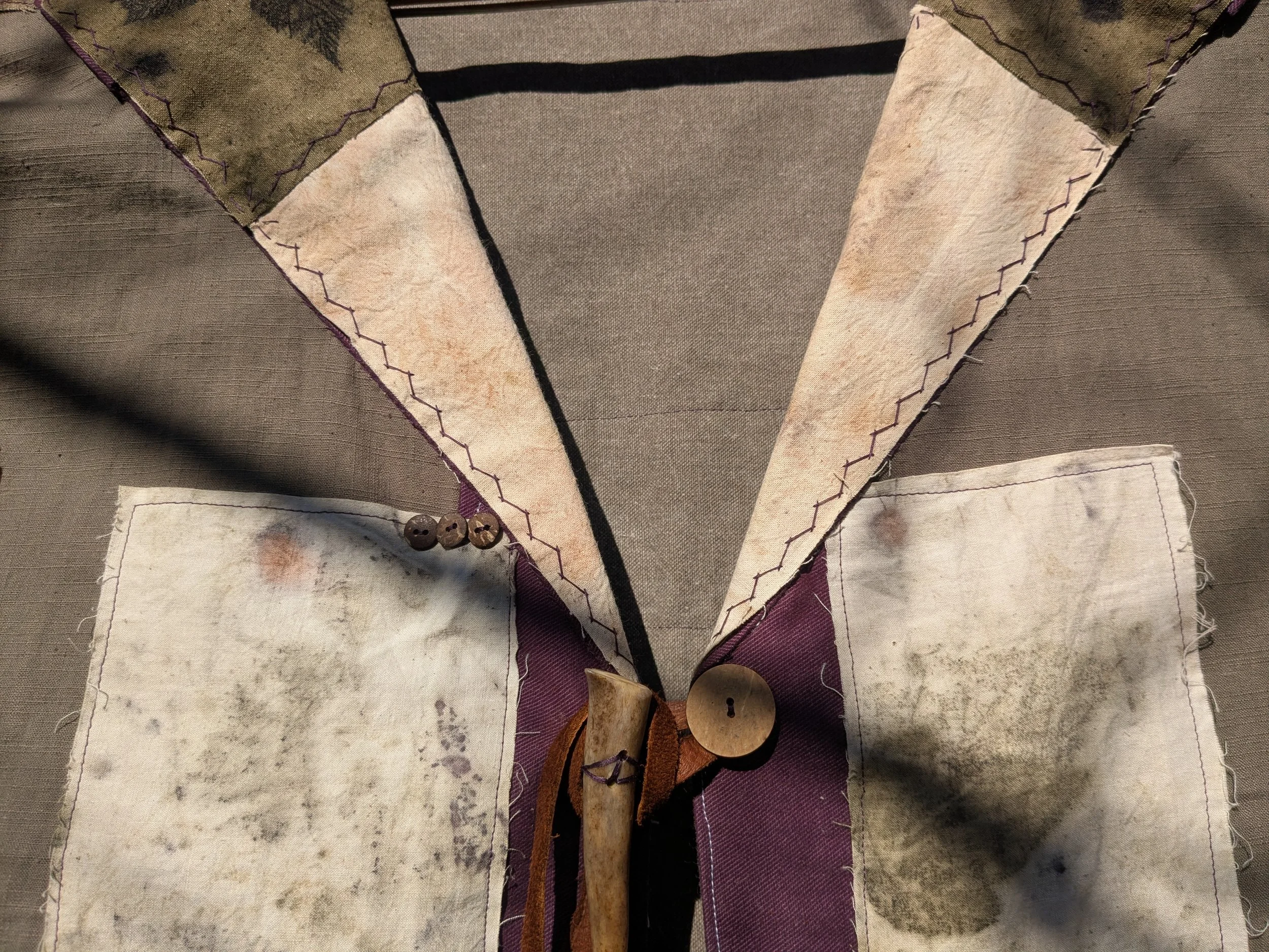 Autumn shawl with eco-printed panels and upcylced fabric and notions.