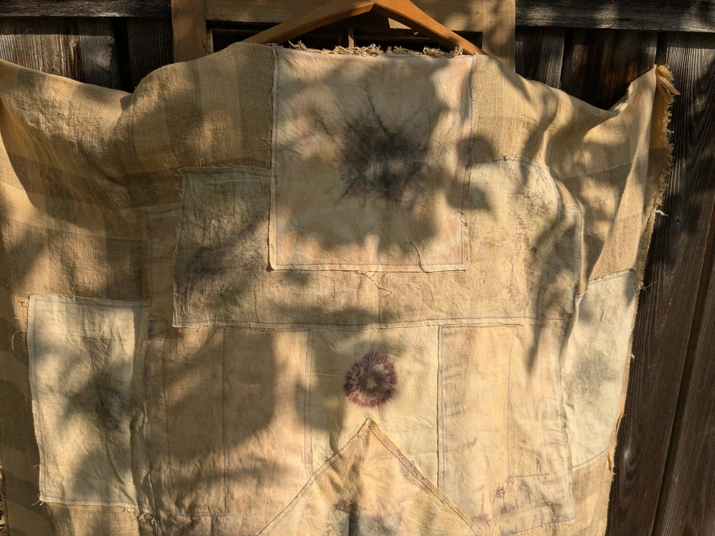 Handcrafted ceremonial shawl, linen and cotton with naturally dyed and eco-printed panels.  Back view.  Sunflower eco-prints.