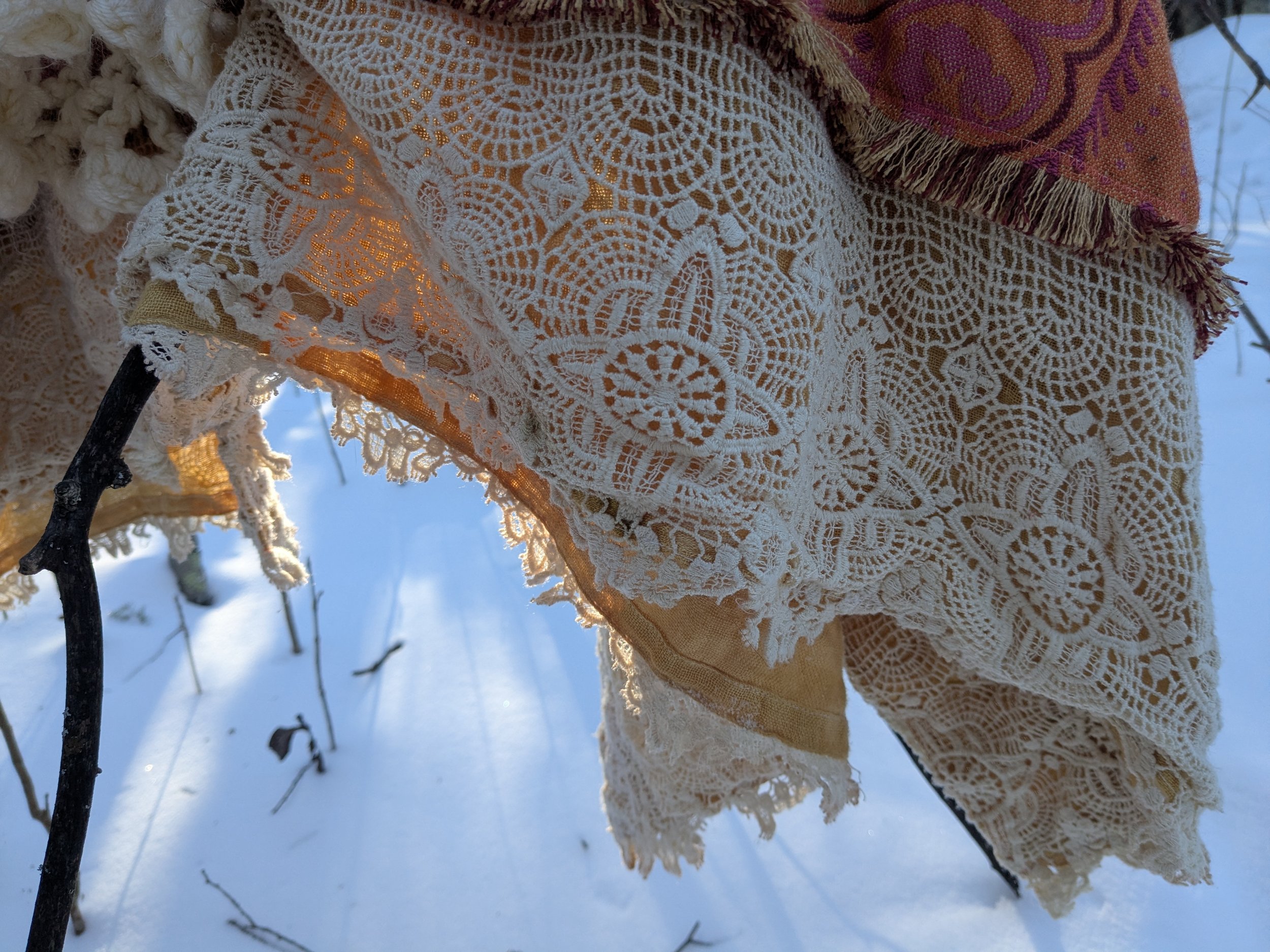 Cozy winter shawl with fully upcycled fabric, view of onion dyed border.