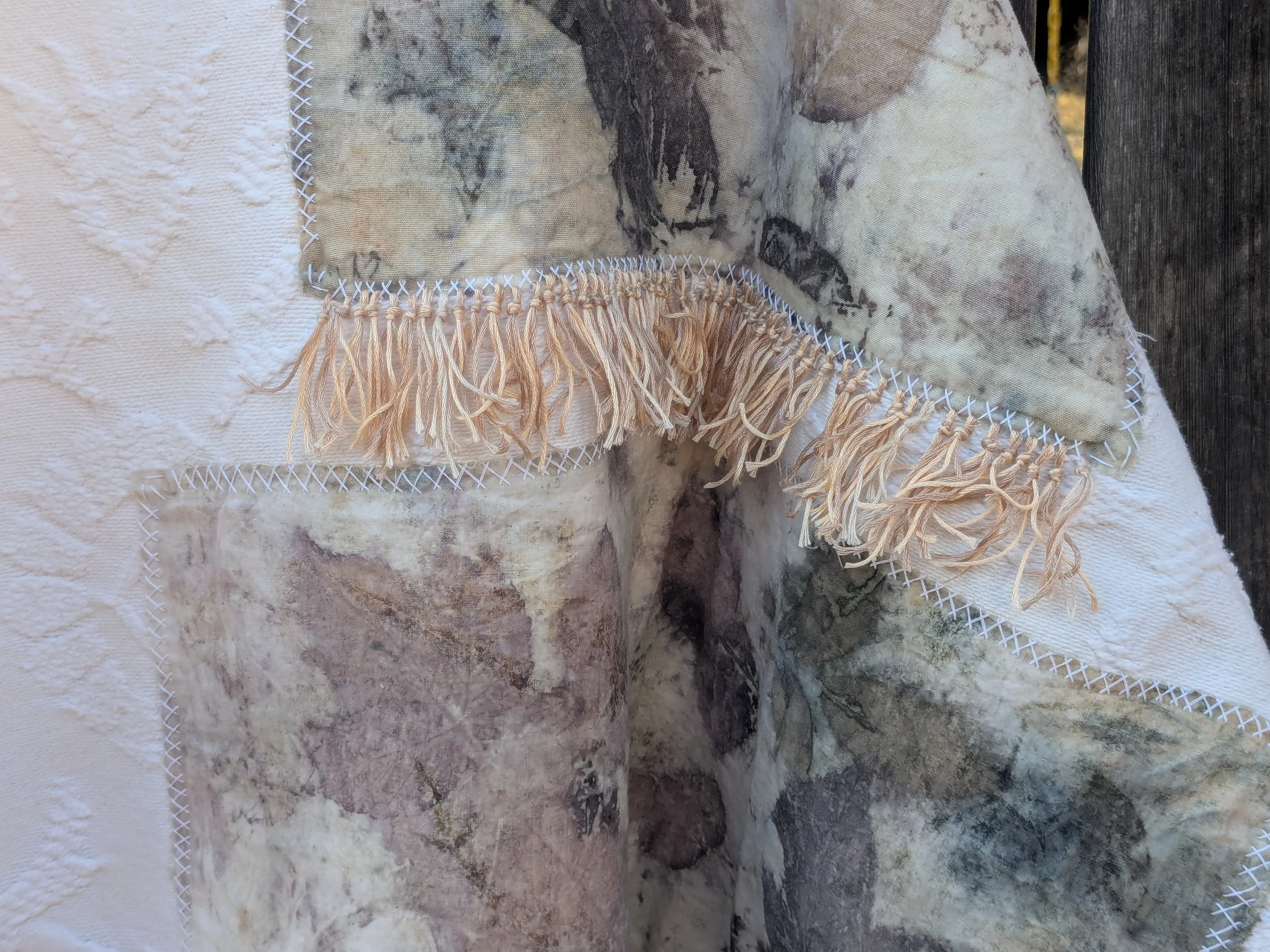 Spring cozy throw shawl made of upcycled white blanket and ecoprint panels.