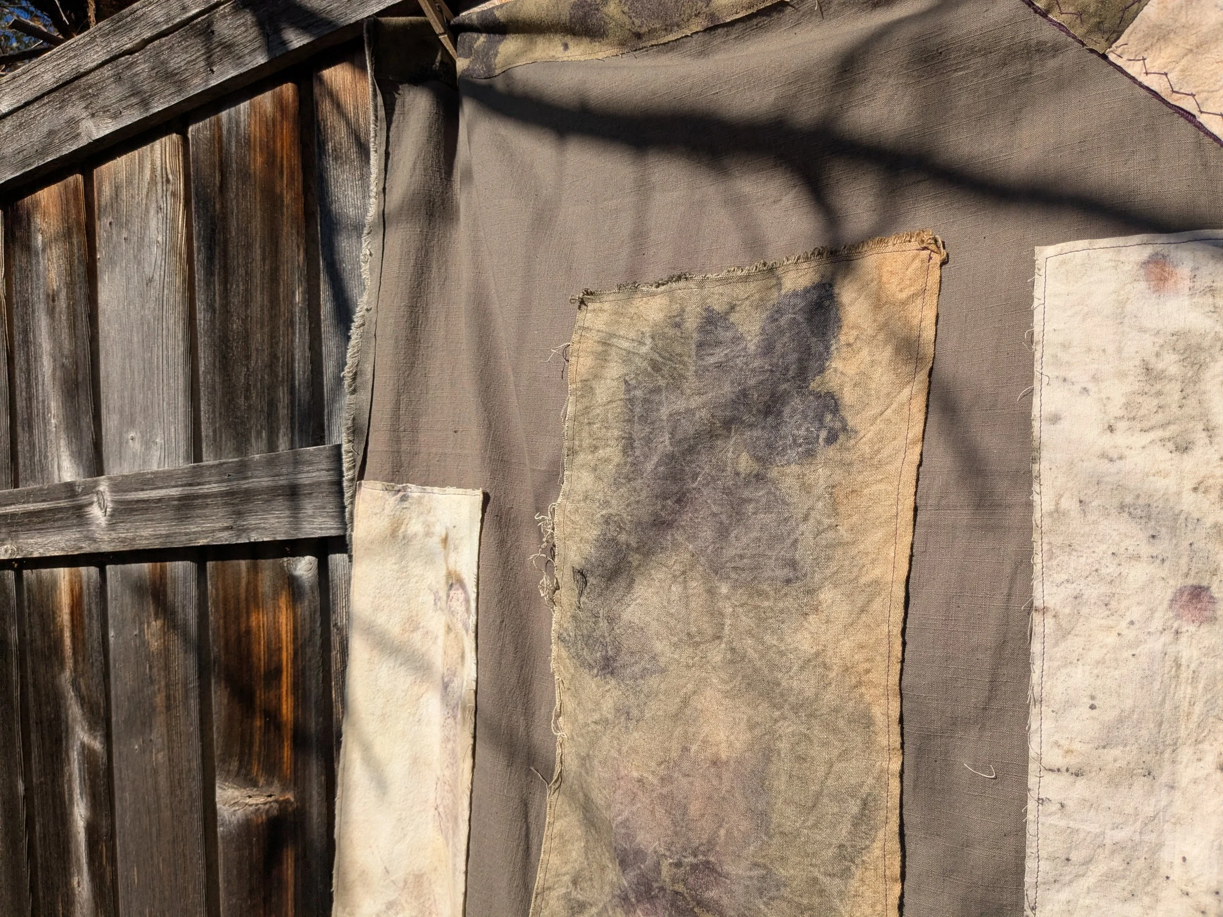 Autumn shawl with eco-printed panels and upcylced fabric and notions.