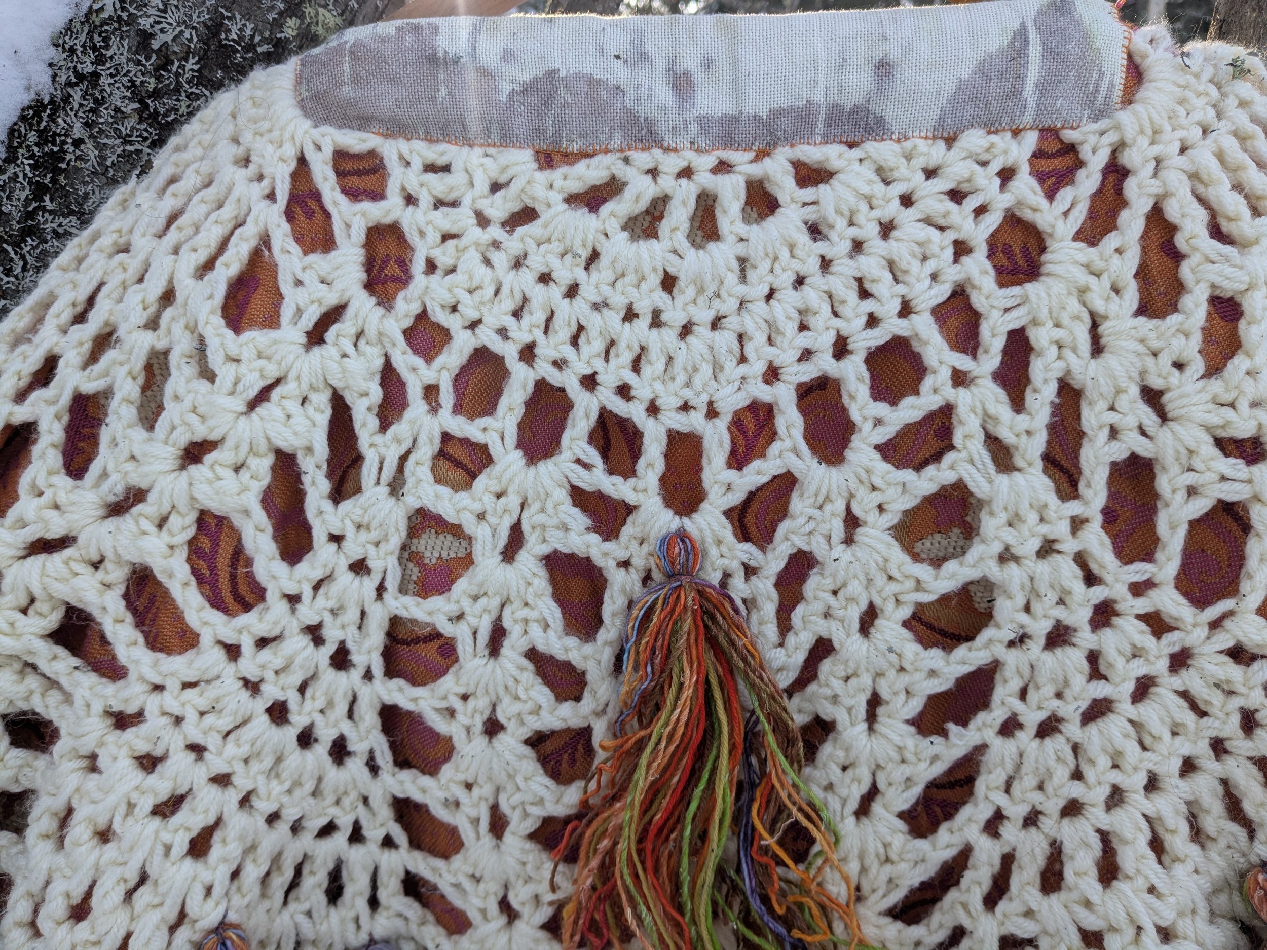 Cozy winter shawl with fully upcycled fabric, back view close-up.