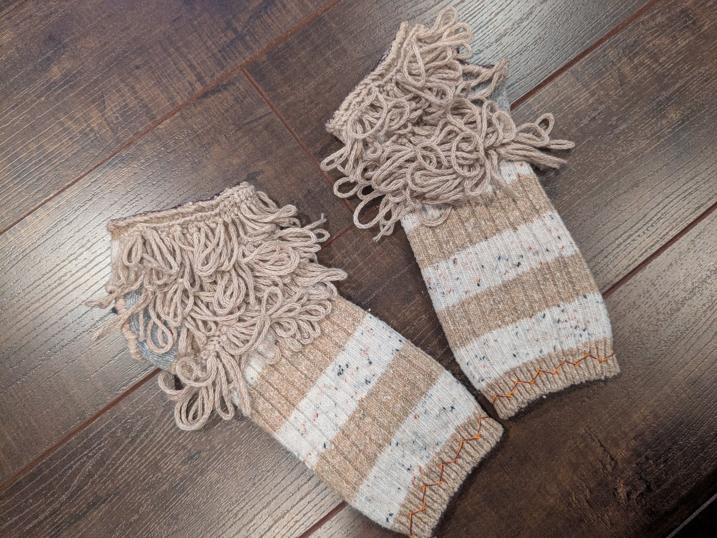 Reworked socks into fingerless gloves.