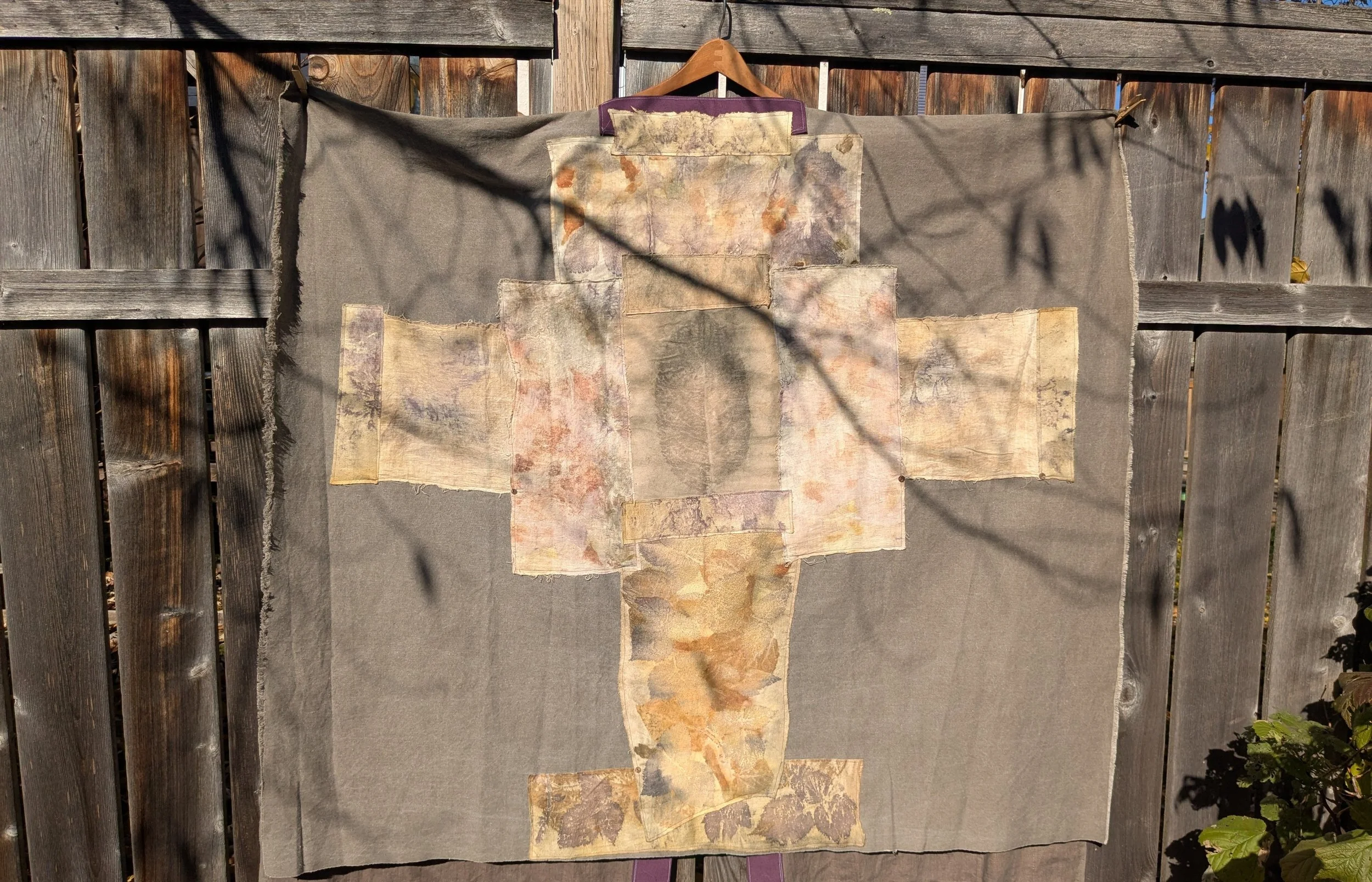 Autumn shawl with eco-printed panels and upcylced fabric and notions.