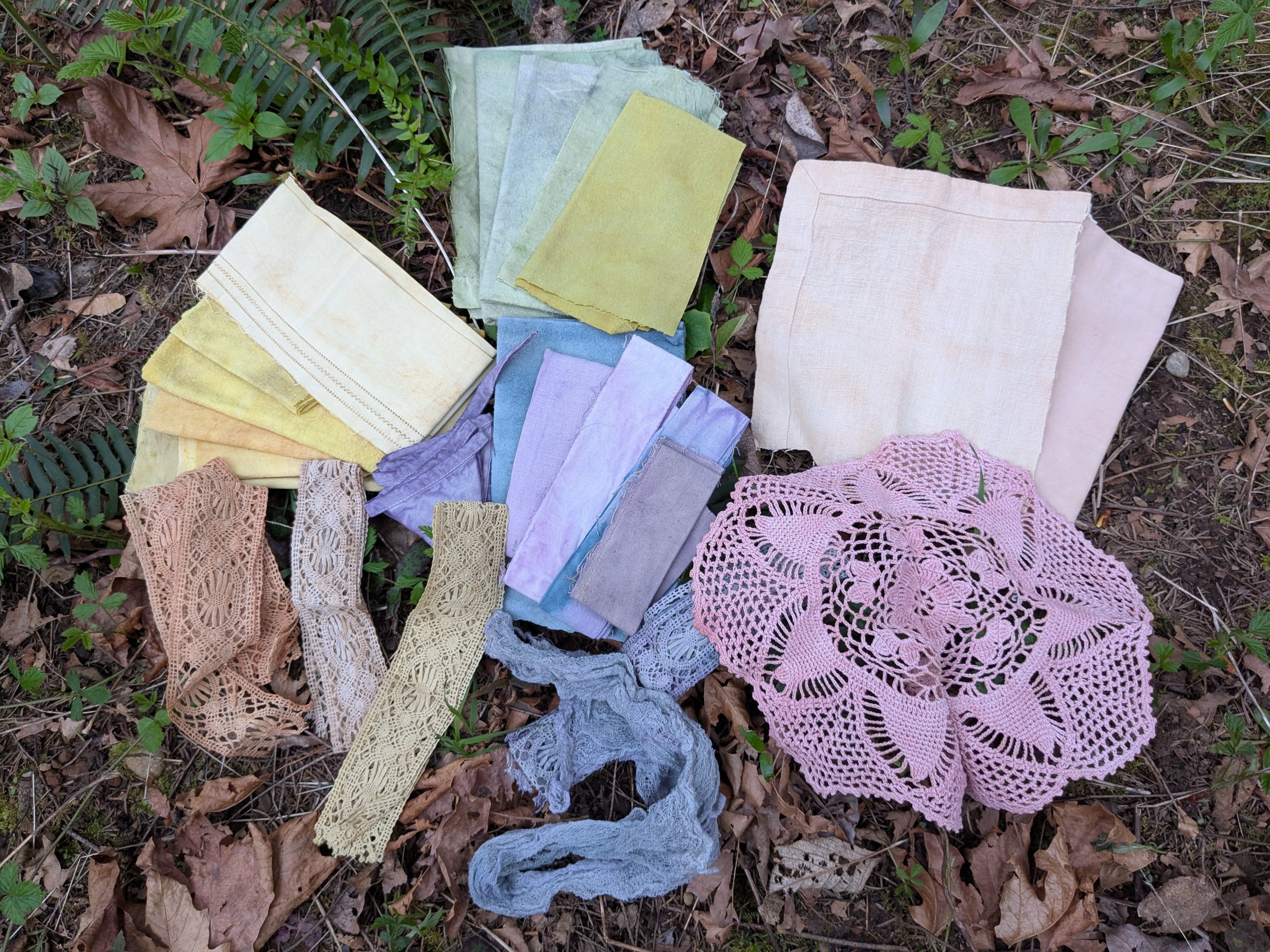 Array of colours and swatches, naturally dyed upcycled fabric.
