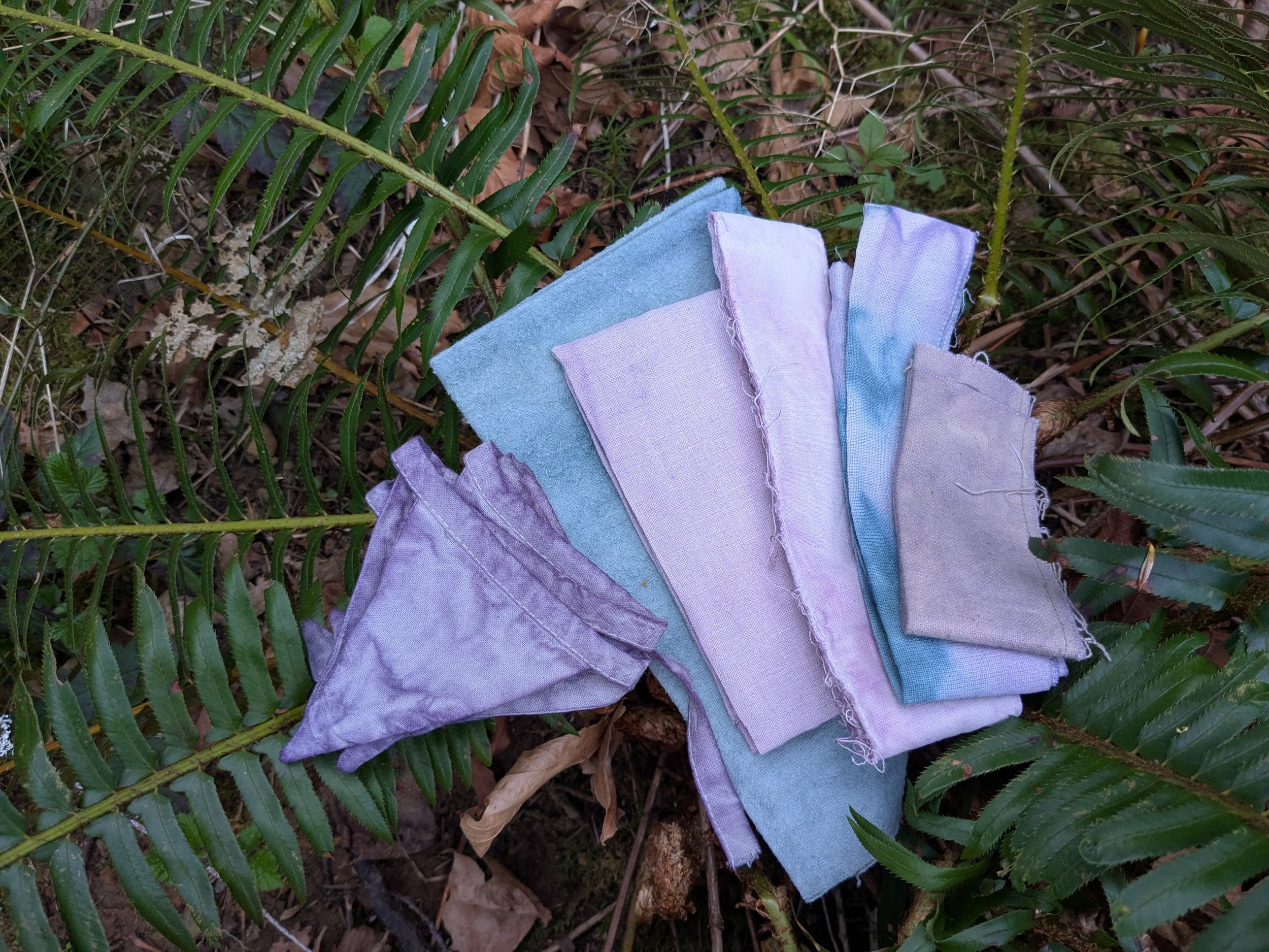 Range of purple and blue swatches, naturally dyed upcycled fabric.