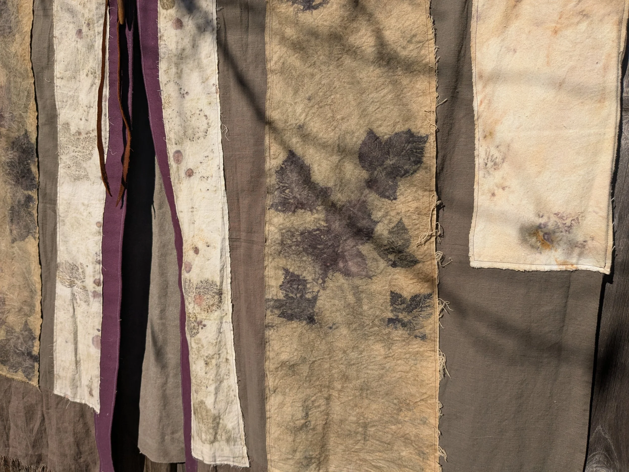Autumn shawl with eco-printed panels and upcylced fabric and notions.