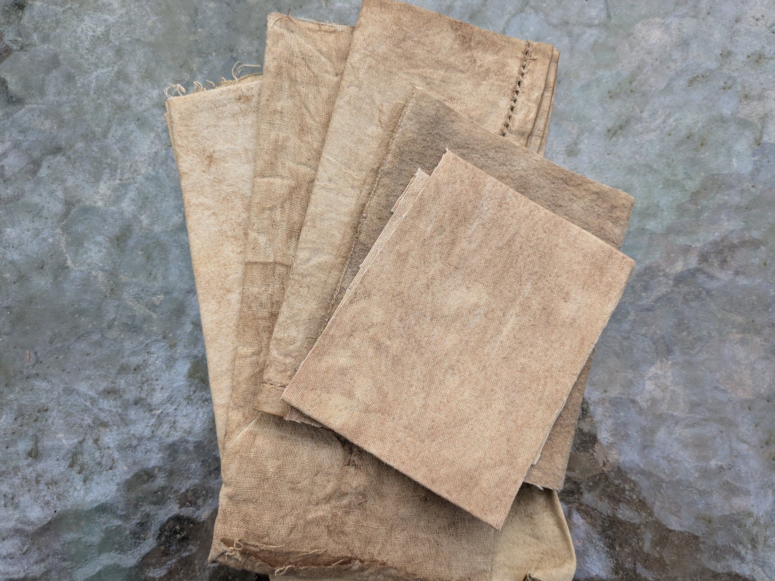 Range of brown swatches, naturally dyed upcycled fabric.