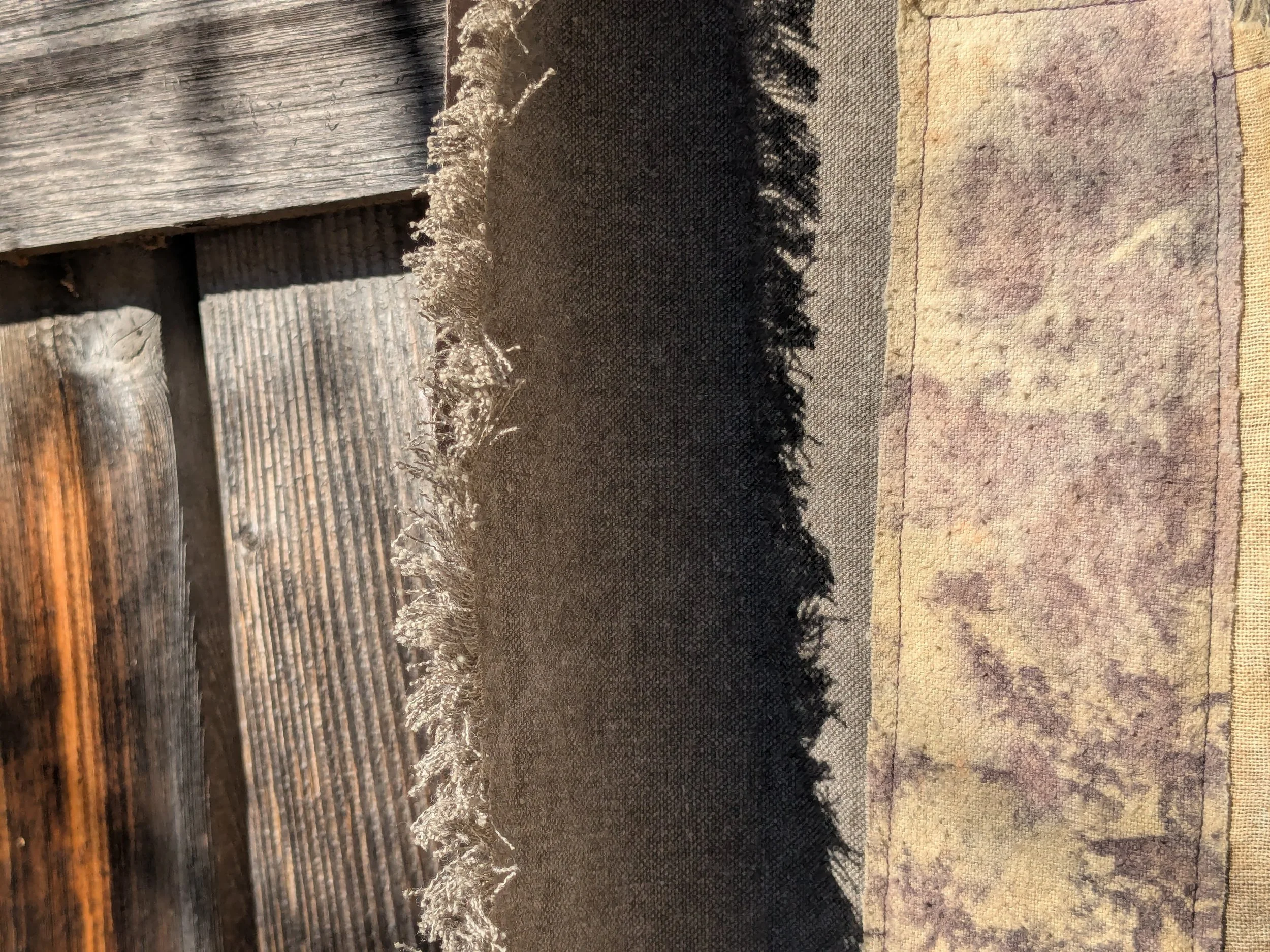 Autumn shawl with eco-printed panels and upcylced fabric and notions.