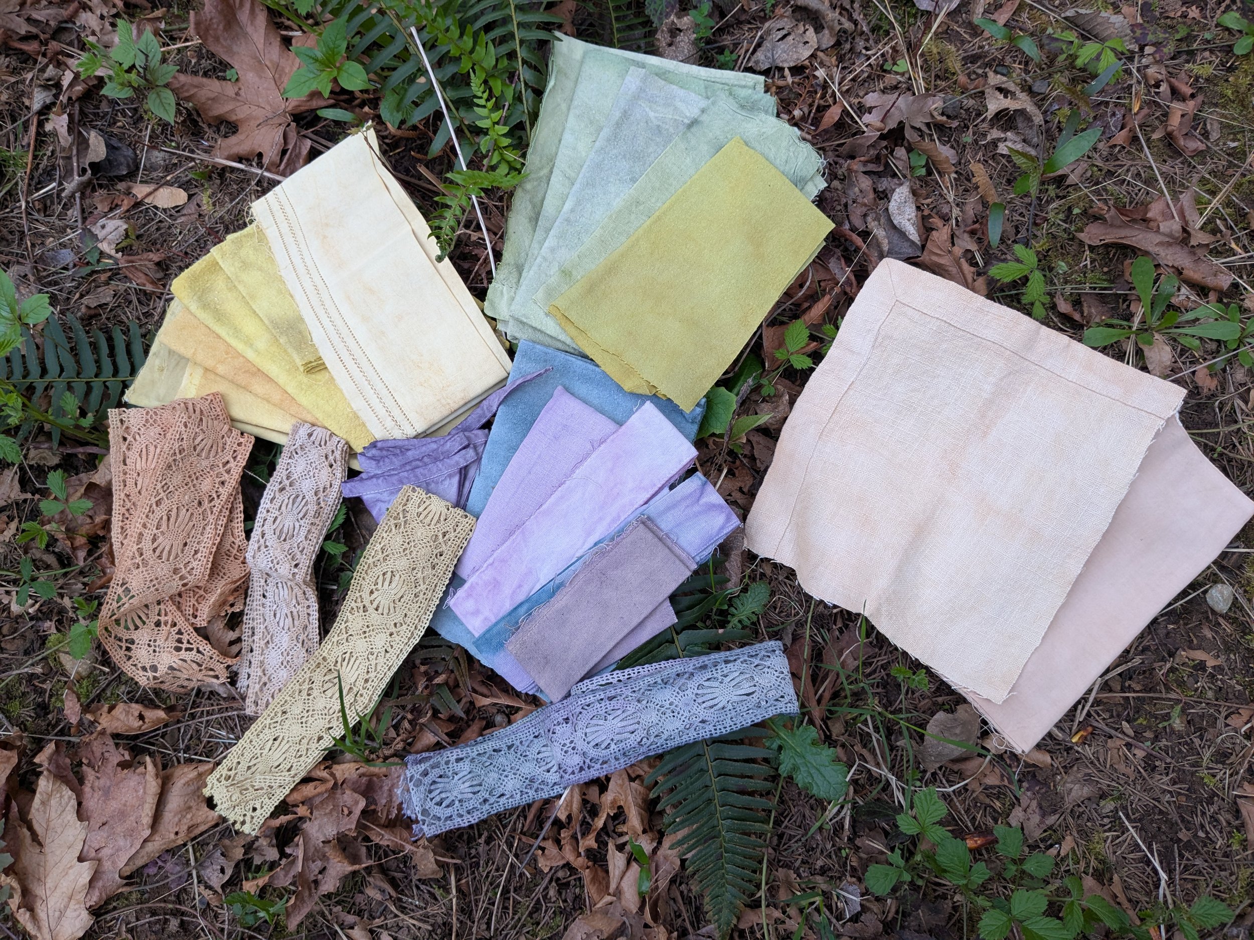 Array of colours and swatches, naturally dyed upcycled fabric.