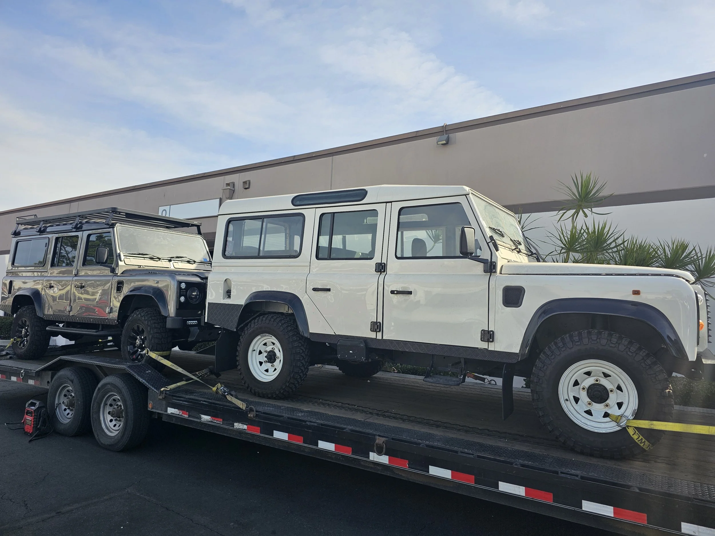 Two Custom Land Rover Defender by Defender Traders in San Diego.