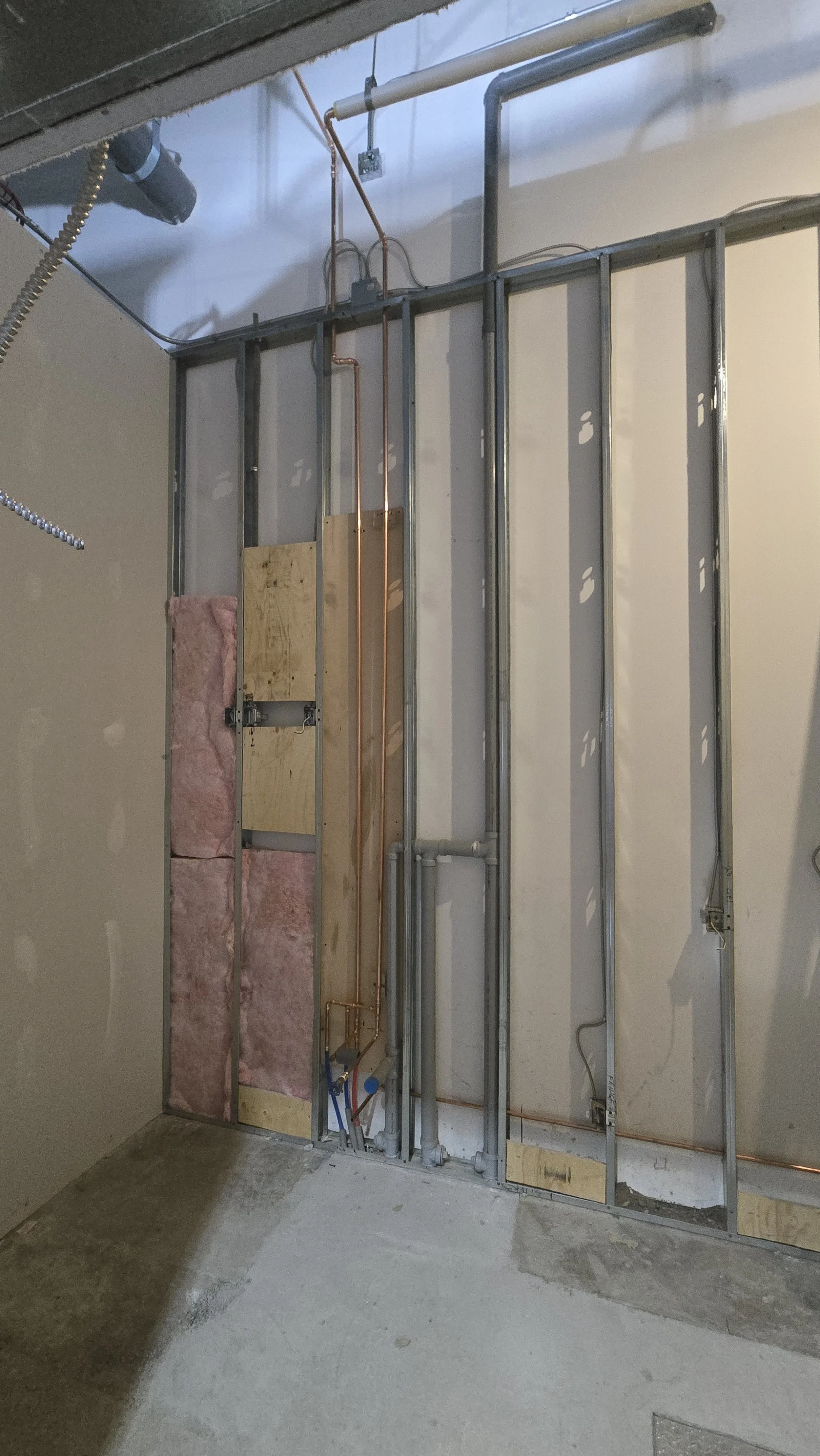 Plumbing wall roughed in at Purdy's Chocolate in Medicine Hat